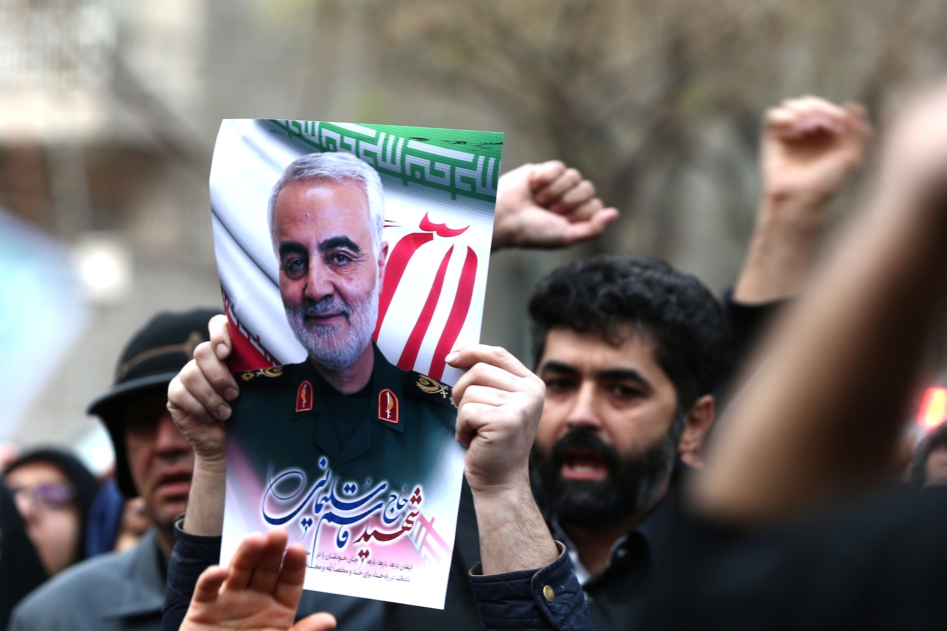 <p>Demonstrators hold a picture of Qasem Soleimani as they protest his assassination by the United States in Tehran, Iran, on January 3. </p>
