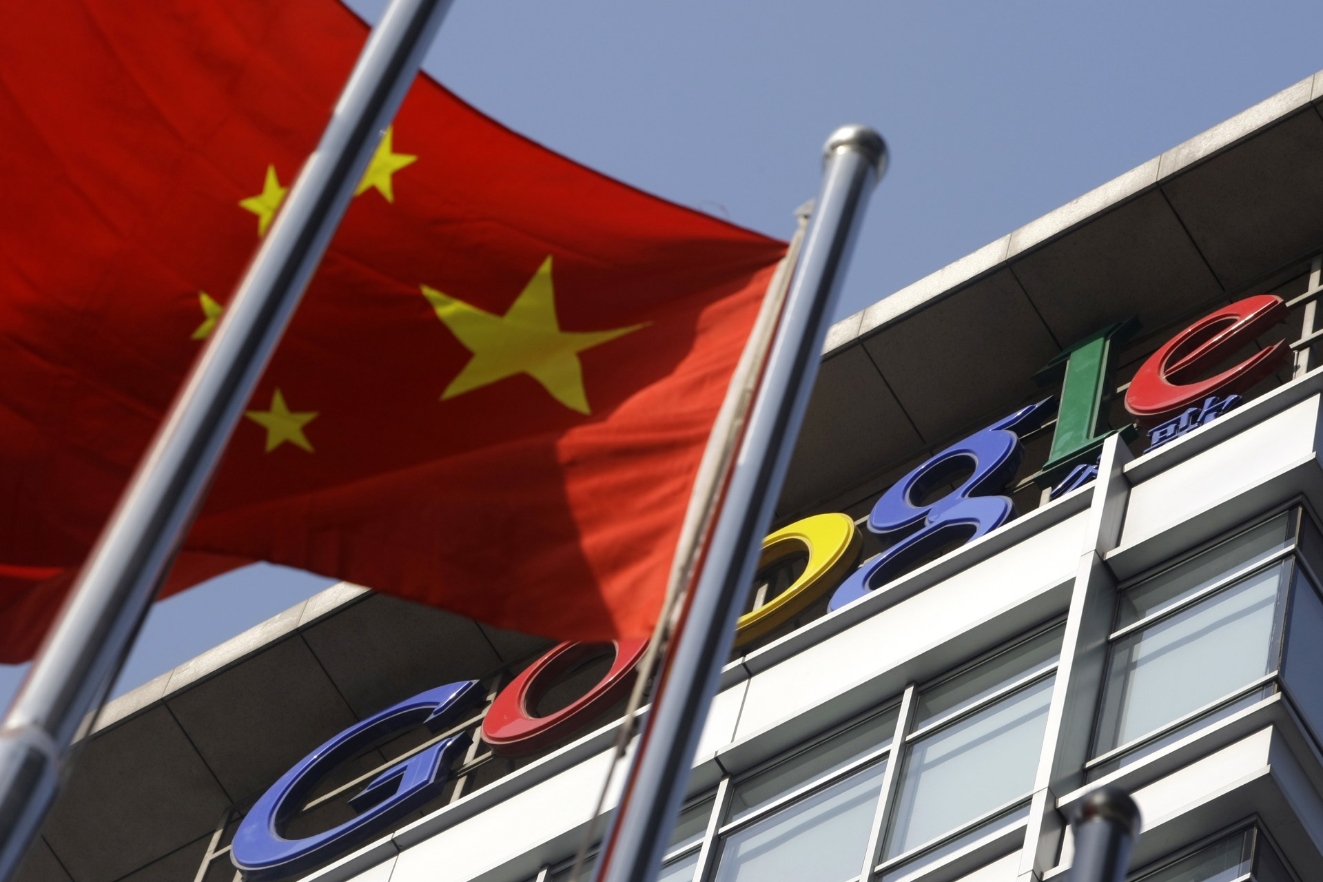 <p>A Chinese national flag flies in front of Google China’s headquarters in Beijing</p>