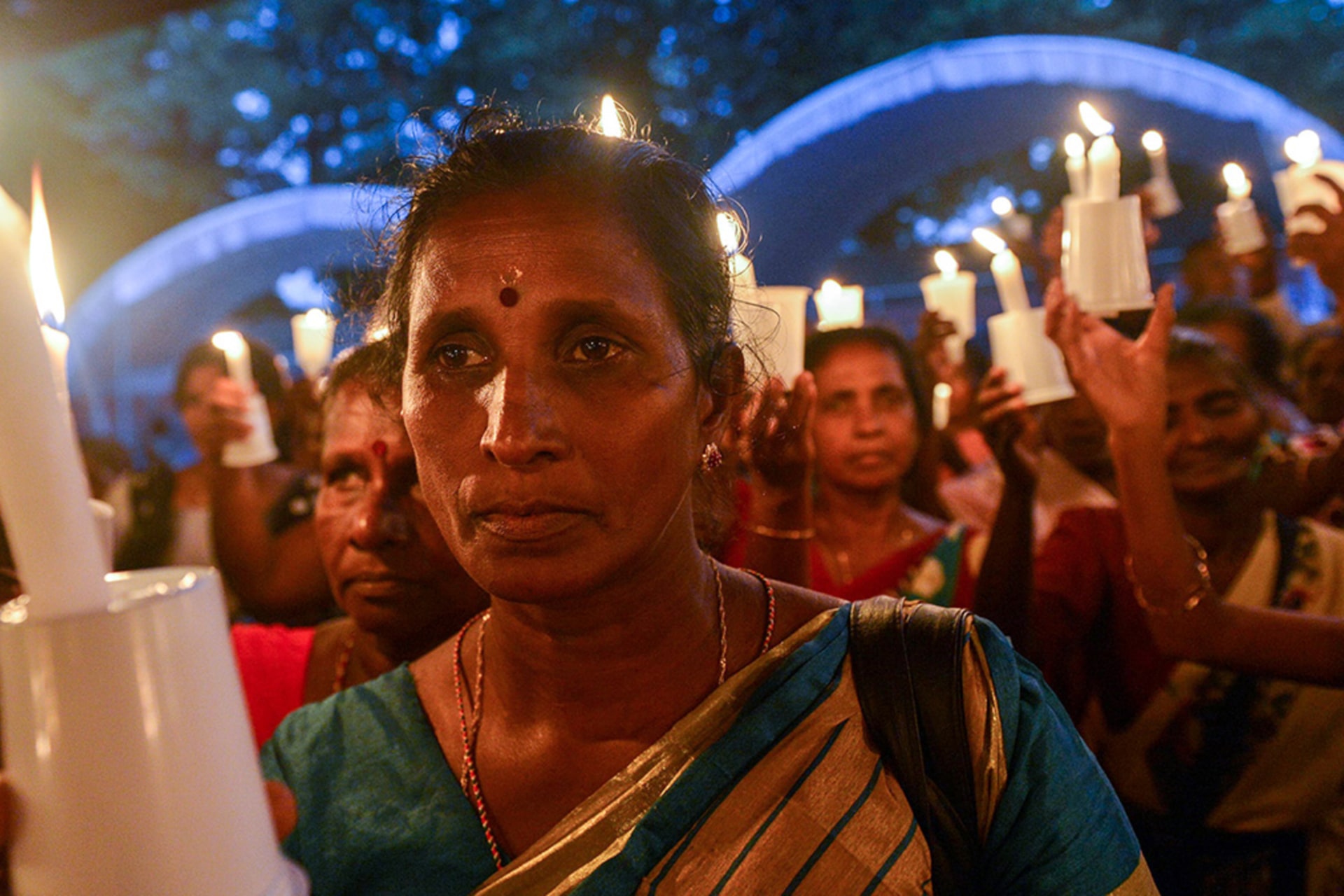 <p>A woman at a candlelight vigil in Colombo, Sri Lanka in 2017, in remembrance of the minority Tamils missing since the Sri Lankan civil war ended in 2009.</p>