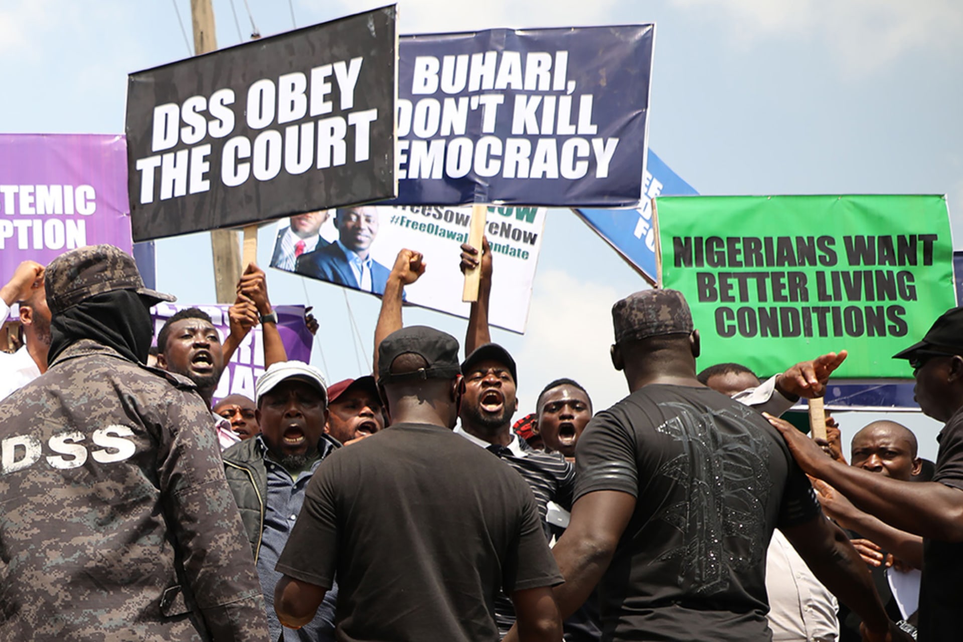 <p>People demonstrate to demand the release of activist and opposition politician Omoyele Sowore, facing treason charges over calls for a “revolution” against the government, outside Department of State Security headquarters in Abuja, on November 12, 2019.</p>
