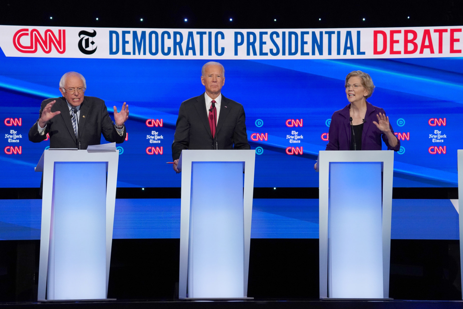 <p>Democratic presidential candidate Senator Bernie Sanders (L), former Vice President Joe Biden, and Senator Elizabeth Warren (R) debate during the fourth Democratic presidential debate in Ohio on October 15.</p>
