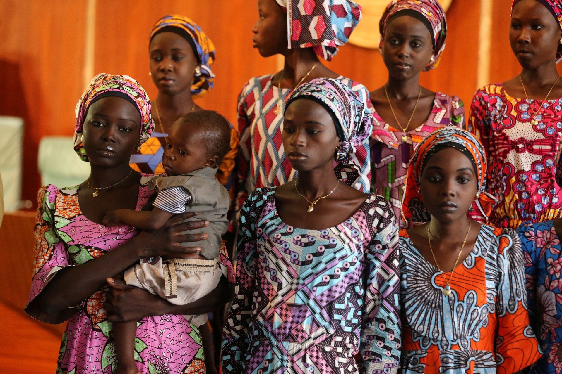 <p>One of the twenty-one Chibok school girls released by Boko Haram carries her baby during their visit to meet Nigerian President Muhammadu Buhari. Abuja, Nigeria. October 19, 2016.</p>
