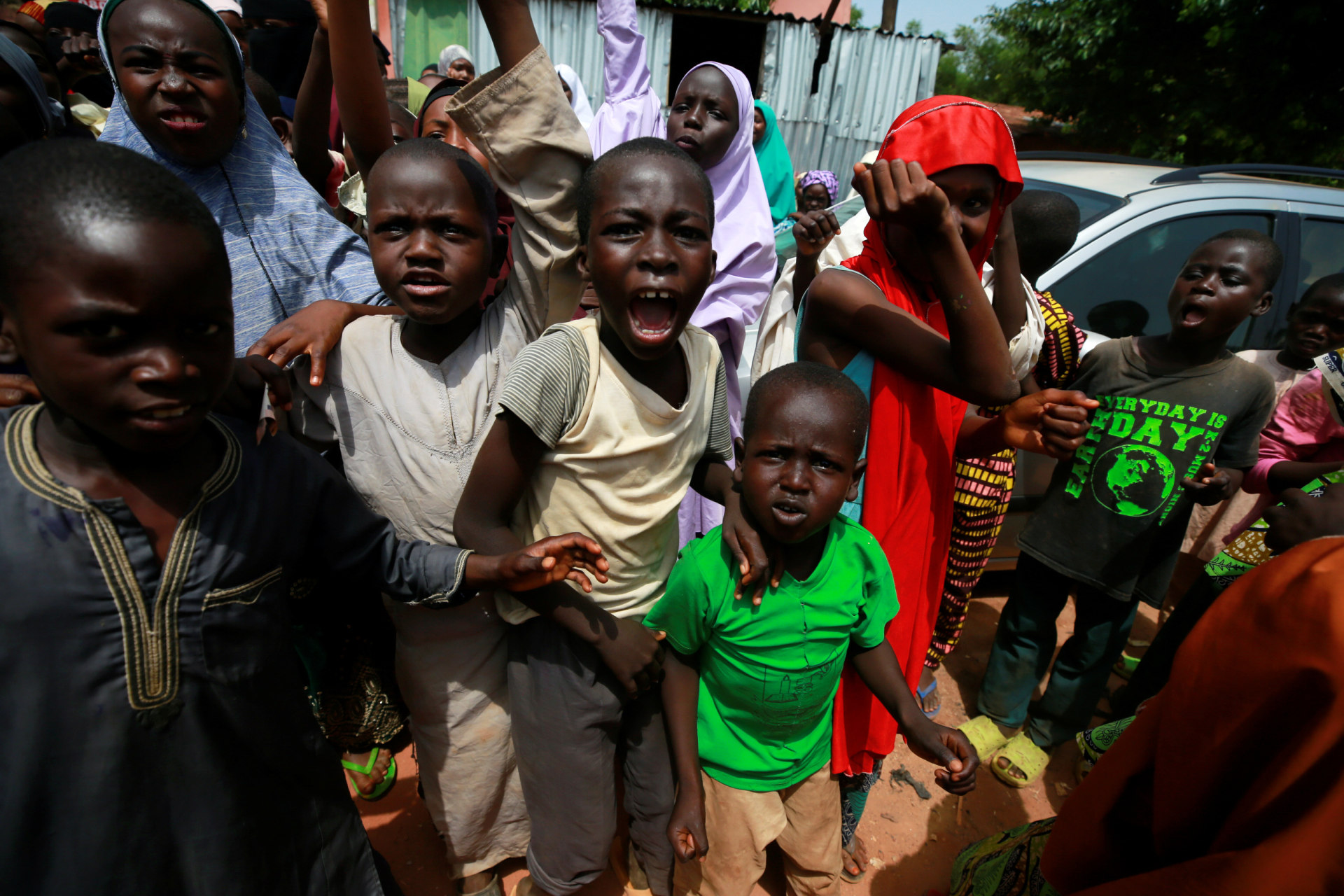 <p>Children protest outside the building where hundreds of men and boys were rescued from captivity by police in Kaduna, Nigeria, on September 28, 2019. </p>