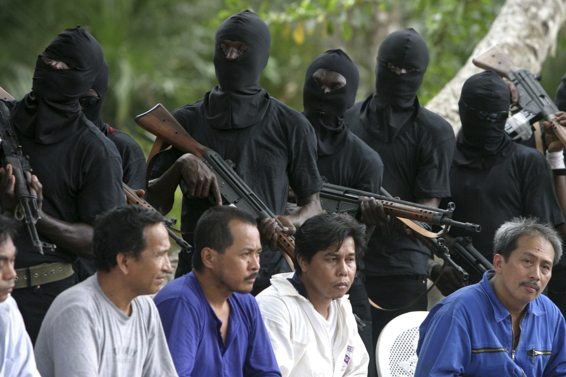 <p>Filipino hostages guarded by militants of the Movement for the Emancipation of Niger Delta (MEND) in the Niger delta on January 31, 2007. Kidnapping was a common tool used by such militants for political ends, but nationwide kidnapping is more criminal.</p>