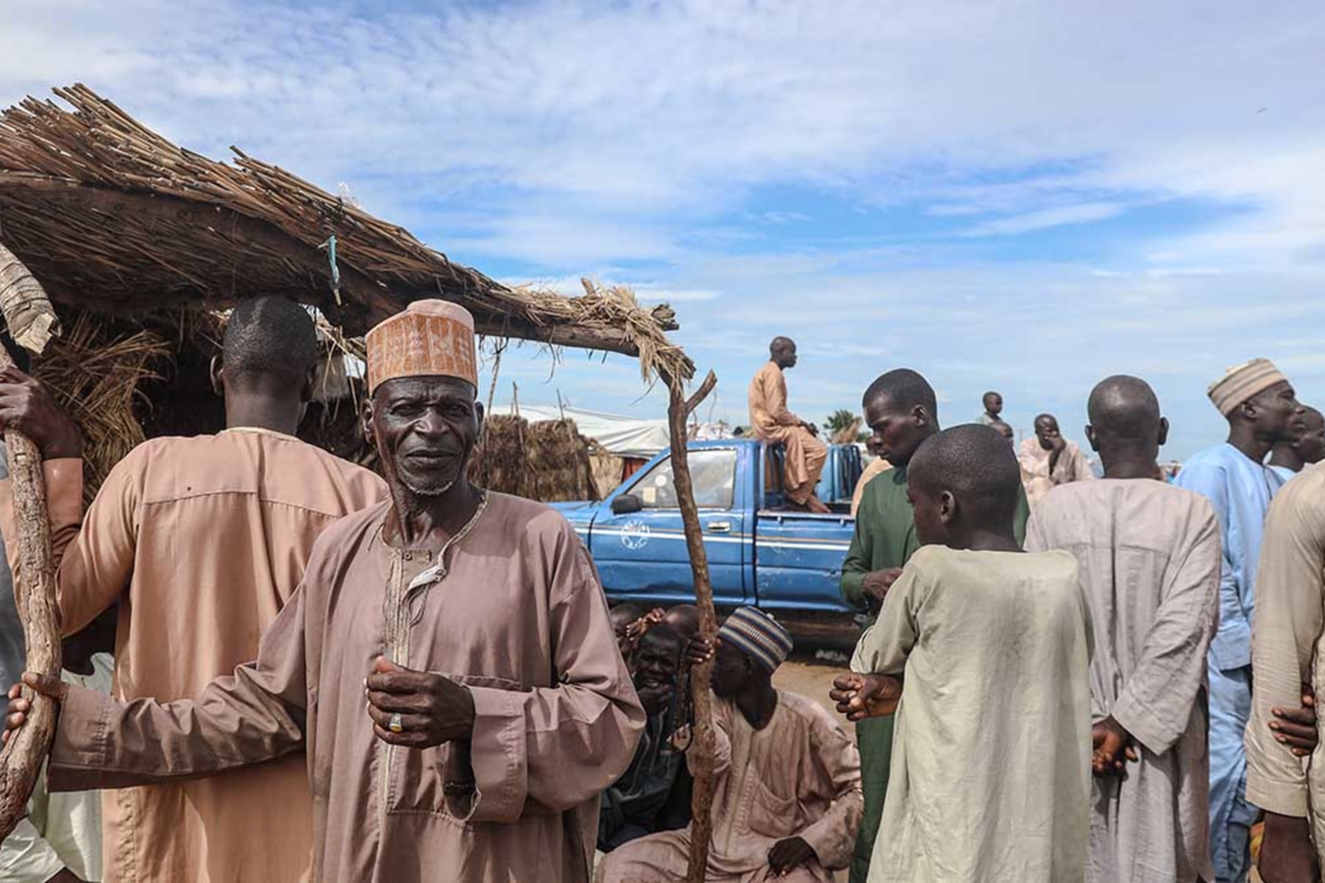 <p>Internally displaced persons gather at the Muna camp in Maiduguri, on July 21, 2019.</p>