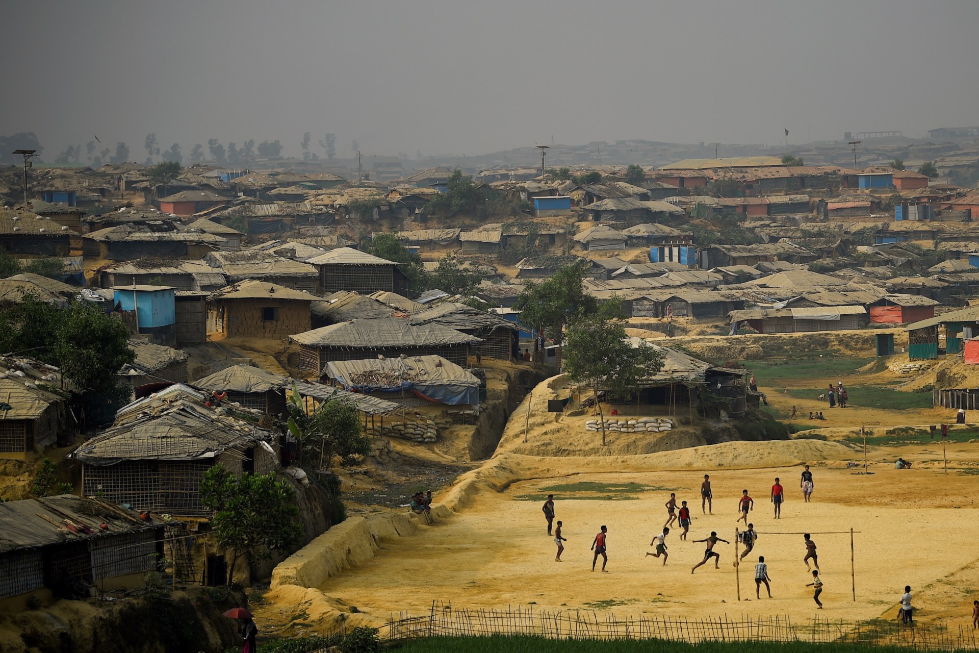 <p>Rohingya refugees play football at Kutupalong refugee camp in Cox’s Bazar, Bangladesh, on March 27, 2018.</p>
