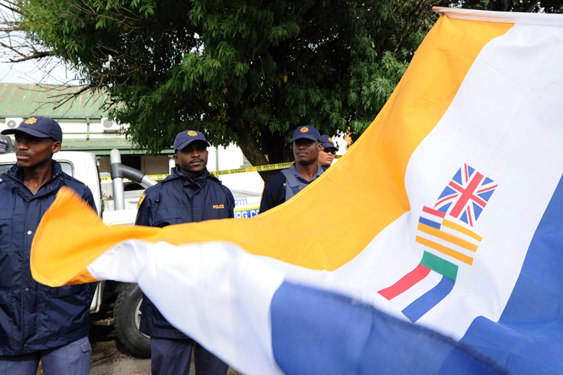 <p>South Africans supporting the white supremacist Afrikaner Resistance Movement (AWB) fly the apartheid-era flag on April 6, 2010, outside a South African court in the northwestern town of Ventersdorp, South Africa.</p>
