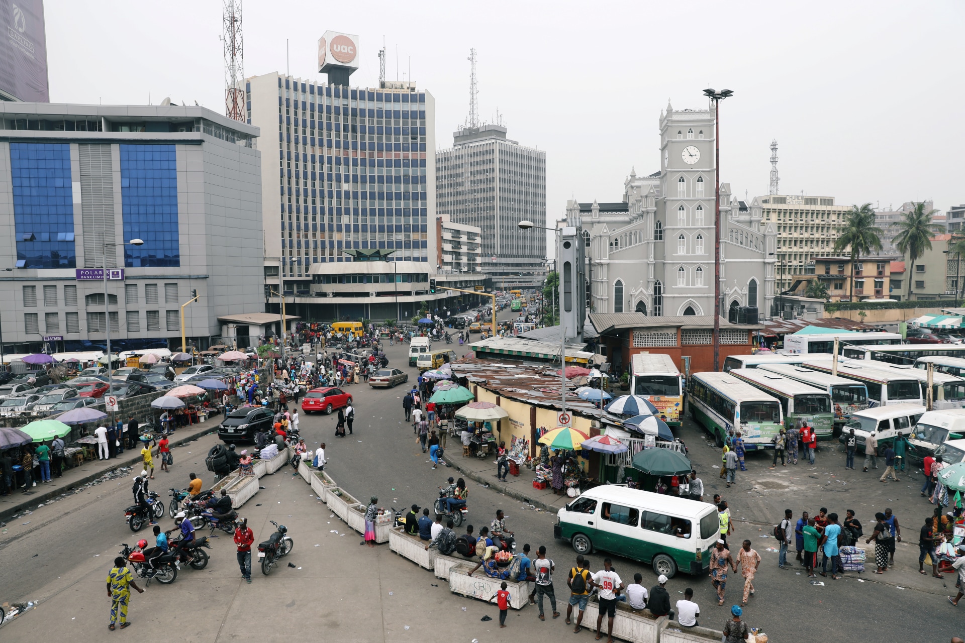 <p>People move on a street of Marina in Victoria Island, Lagos, Nigeria, on February 15, 2019.</p>
