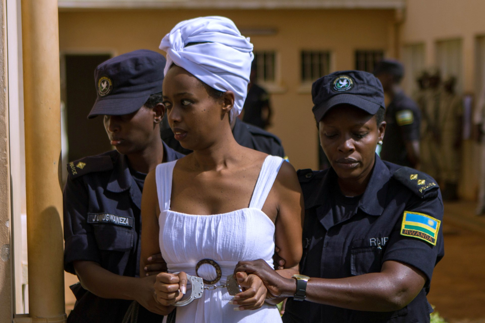 <p>Diane Shima Rwigara, a prominent critic of Rwandan President Paul Kagame, is escorted by police officers into a courtroom in Kigali, Rwanda, on October 11, 2017.</p>