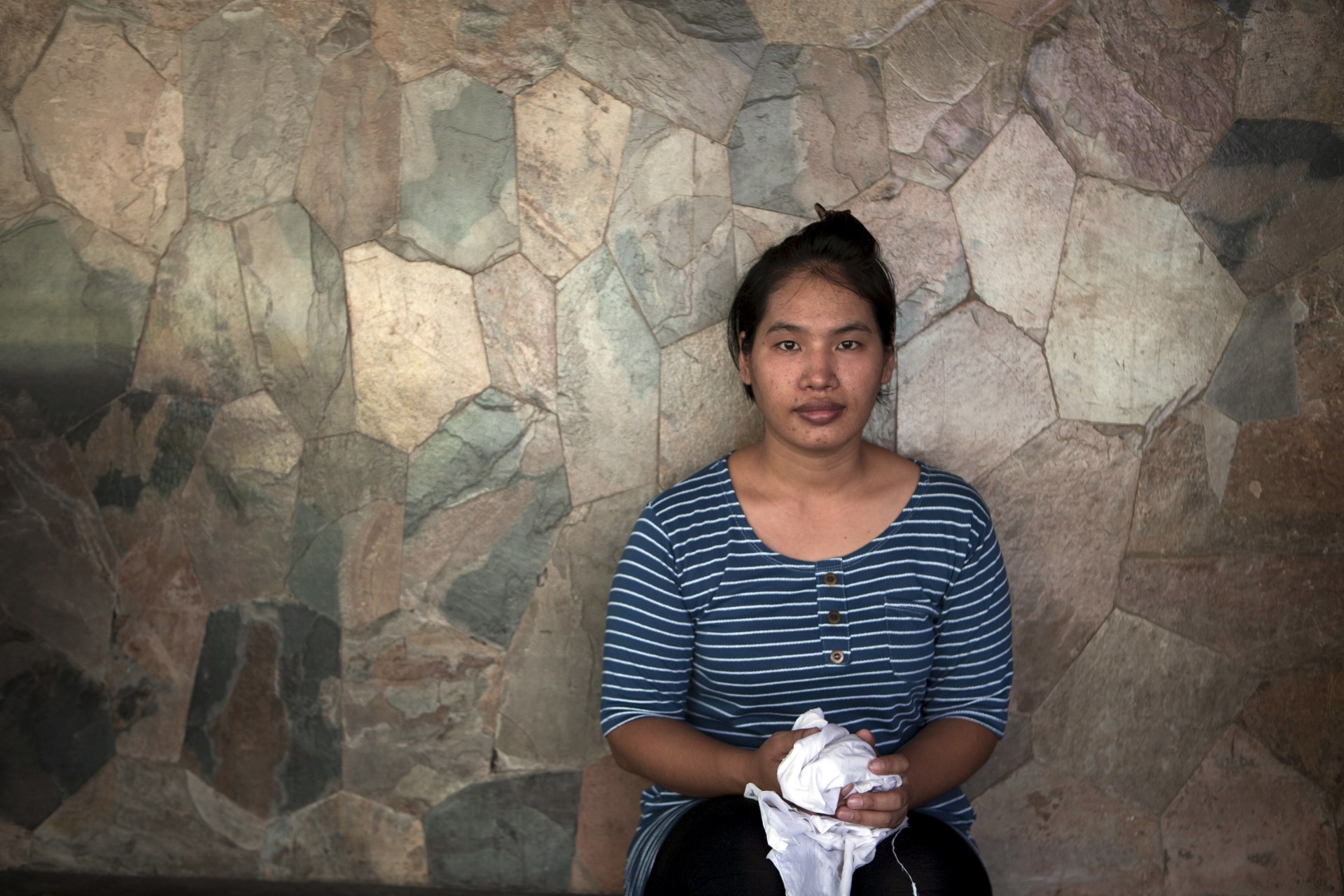 <p>Suay Ing, daughter of migrant construction workers from Myanmar, was fourteen years old when she was trafficked to Bangkok, Thailand, by a broker who promised her a job and abandoned her. May 25, 2015.</p>
