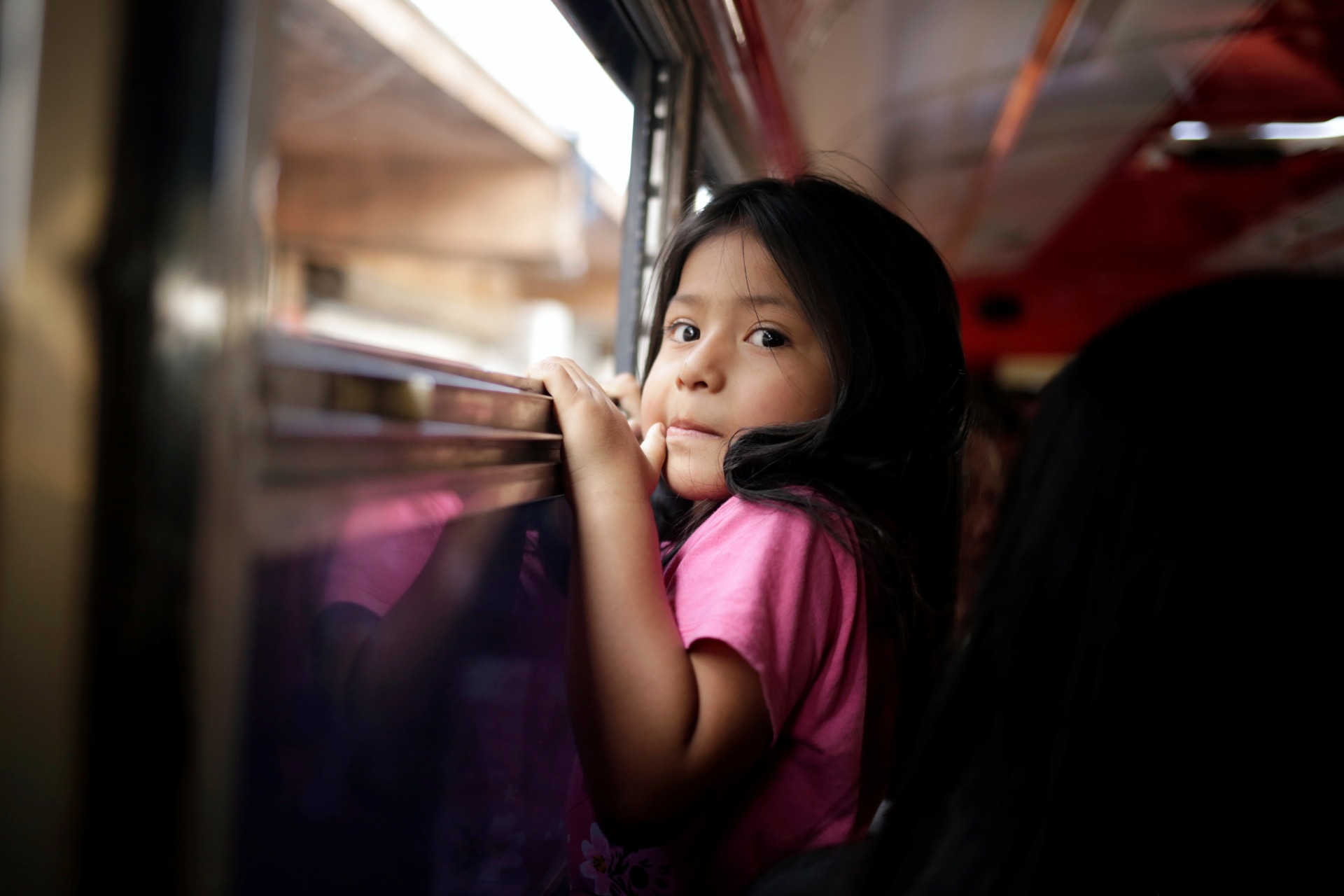<p>Salvadoran migrant child, Lupe, sits on a bus as she leaves the premises of the National Migration Institute (INM) after being deported from the United States, June 22, 2019.</p>