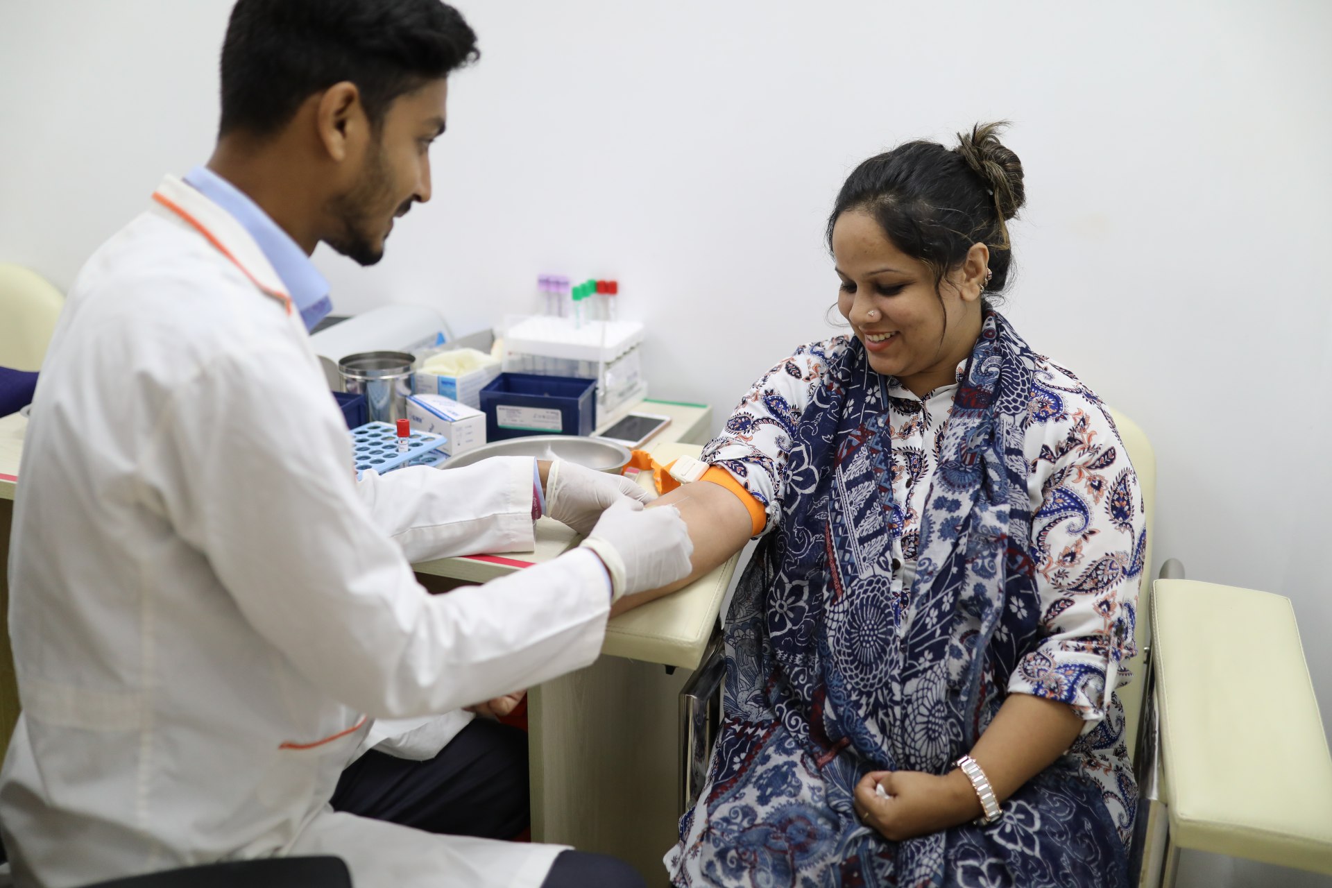 <p>A woman sees a doctor at a Praava Health facility in Bangladesh.</p>
