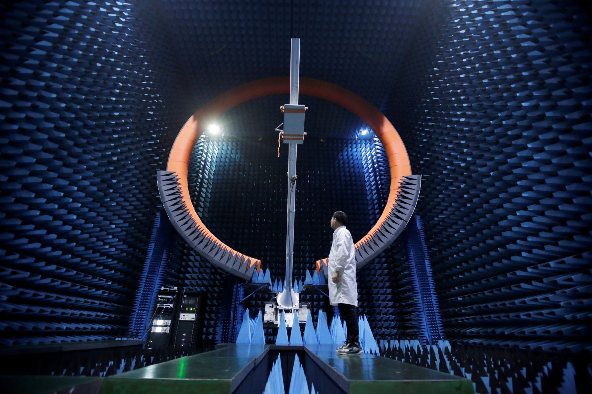 <p>An engineer stands under a base station antenna in Huawei’s SG178 multi-probe spherical near-field testing system at its Songshan Lake Manufacturing Center in Dongguan, China, on May 30, 2019.</p>