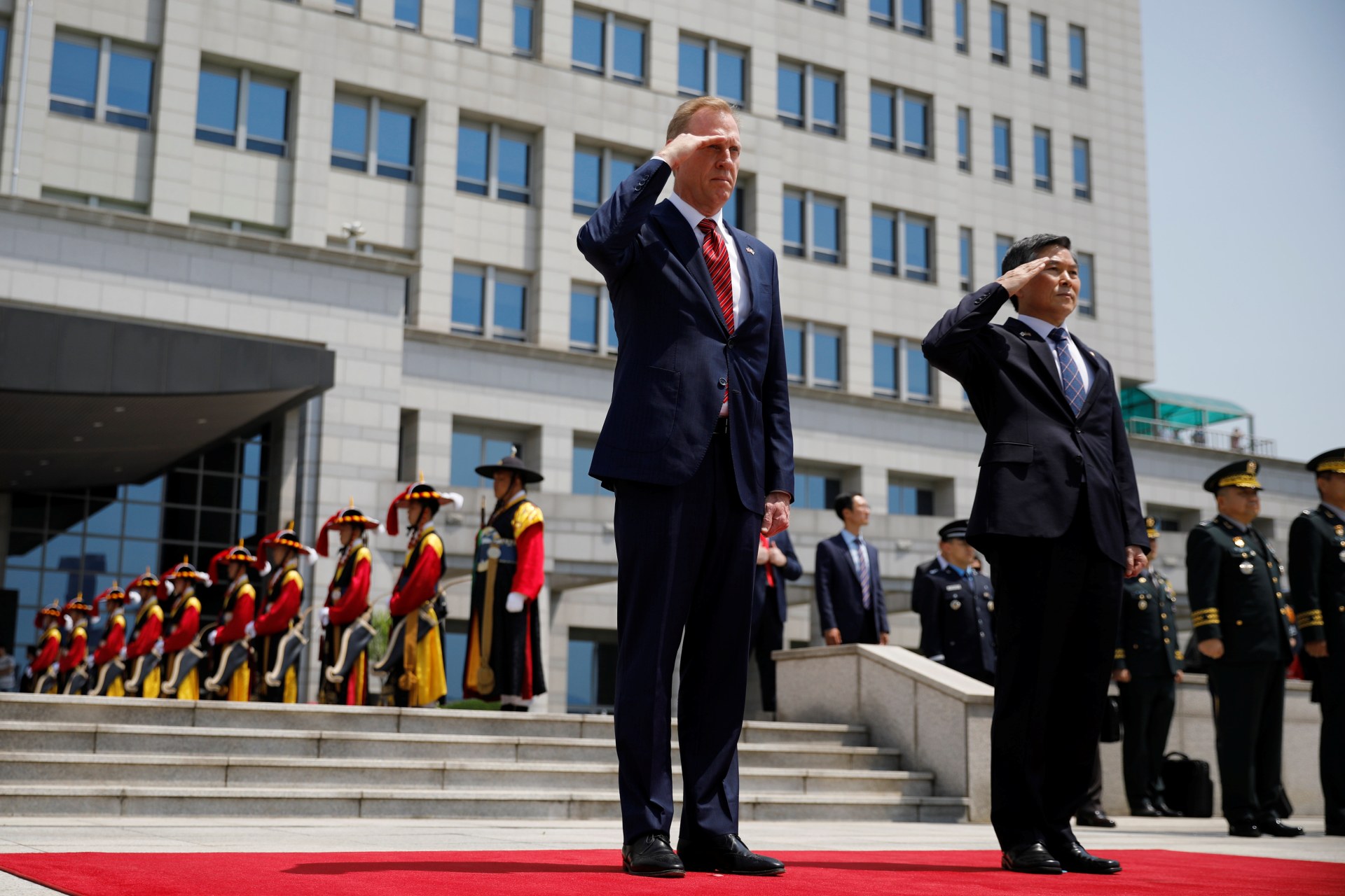 <p>Acting U.S. Defense Secretary Patrick Shanahan and South Korean Defense Minister Jeong Kyeong-doo salute to the national flags during a welcome ceremony at the Defense Ministry in Seoul, South Korea, on June 3, 2019.</p>