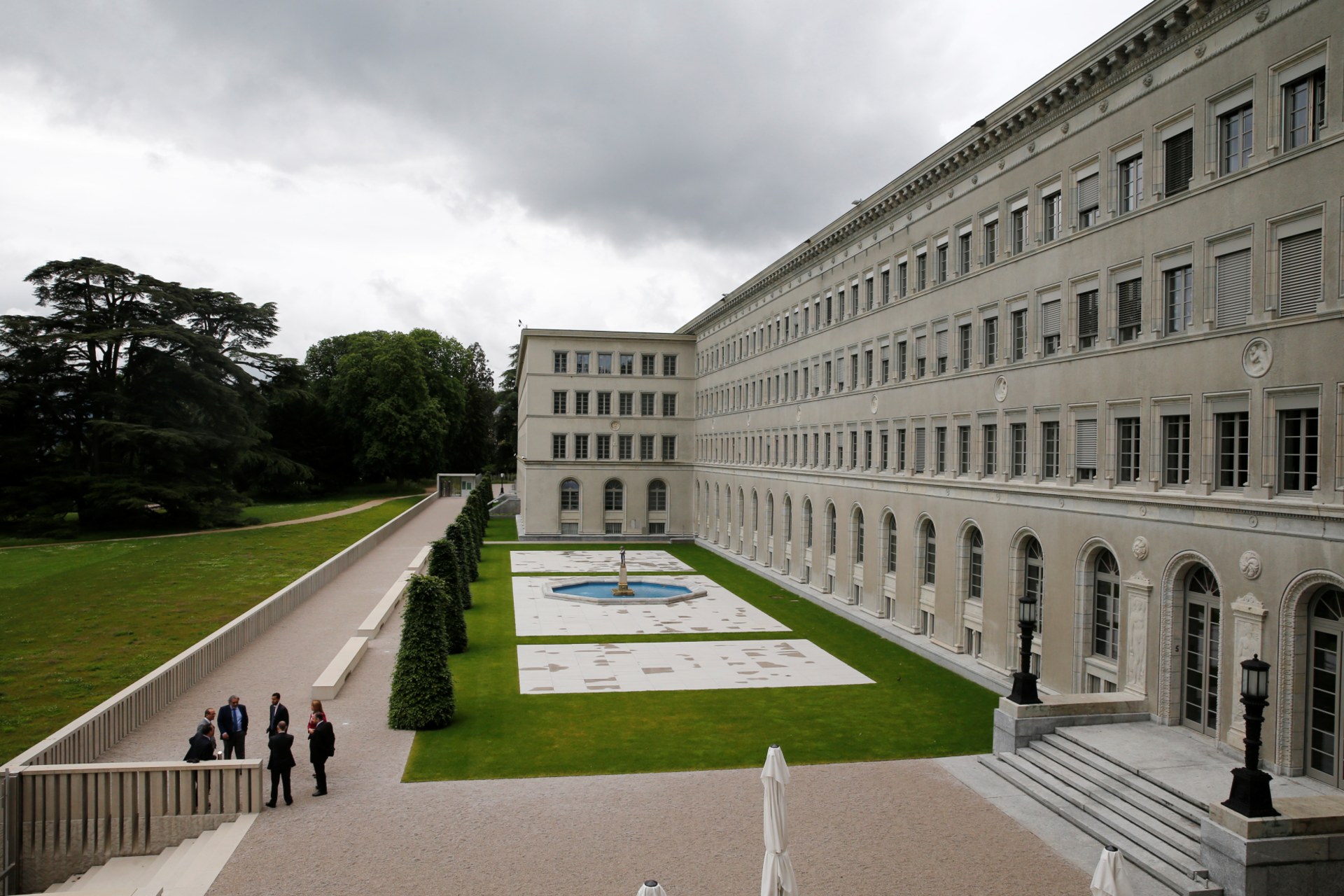 <p>People talk outside the headquarters of the World Trade Organization (WTO) in Geneva, Switzerland, June 3, 2016.</p>
