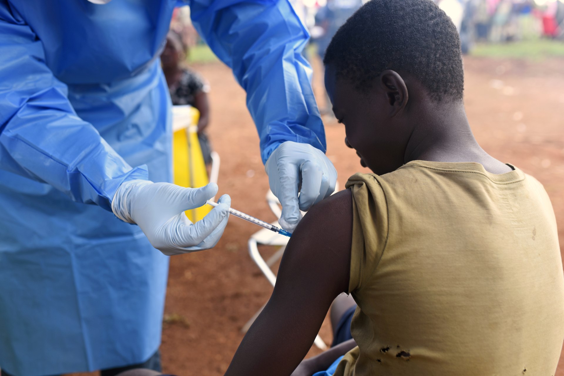 <p>A Congolese health worker administers Ebola vaccine to a boy who had contact with an Ebola sufferer in the village of Mangina in North Kivu province of the Democratic Republic of Congo, on August 18, 2018. </p>
