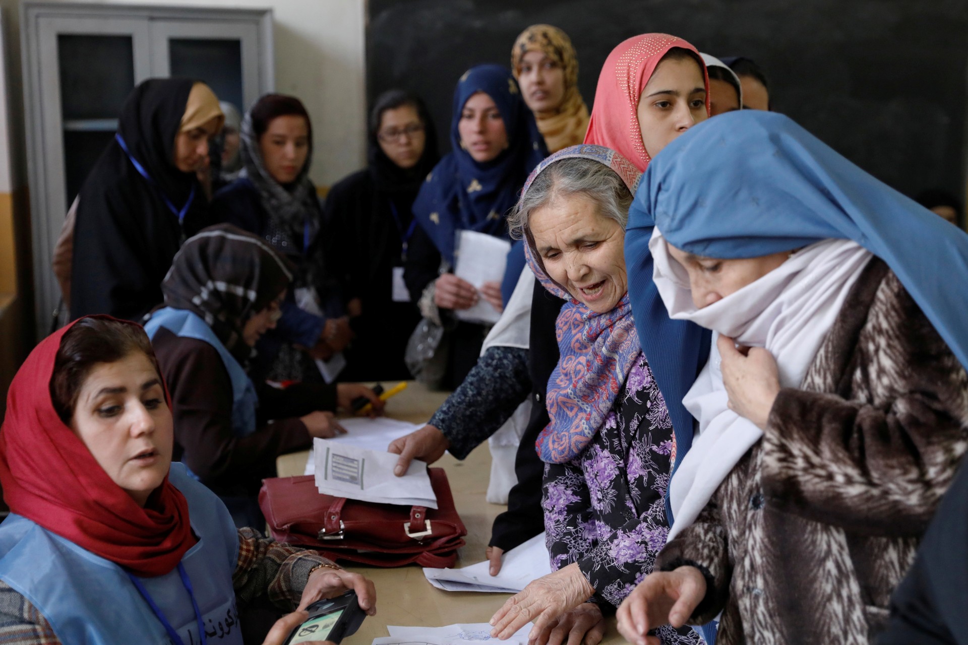 <p>Afghan women line up at a polling station during parliamentary elections in Kabul, Afghanistan October 20, 2018.</p>