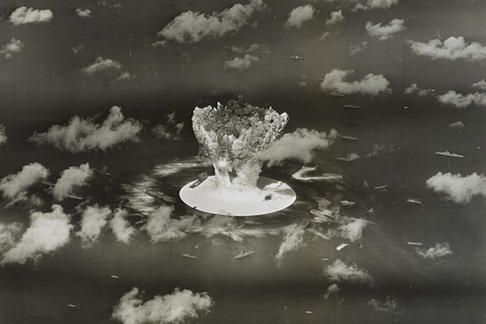 <p>A mushroom cloud rises with ships below during the Operation Crossroads nuclear weapons test on Bikini Atoll, Marshall Islands.</p>