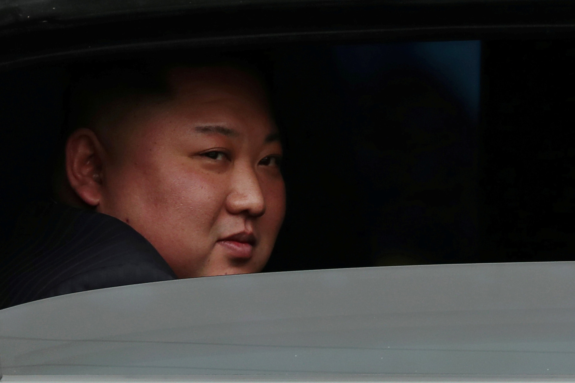 <p>North Korea’s leader Kim Jong-un sits in his vehicle after arriving at the Dong Dang railway station, Vietnam, at the border with China on February 26, 2019. </p>