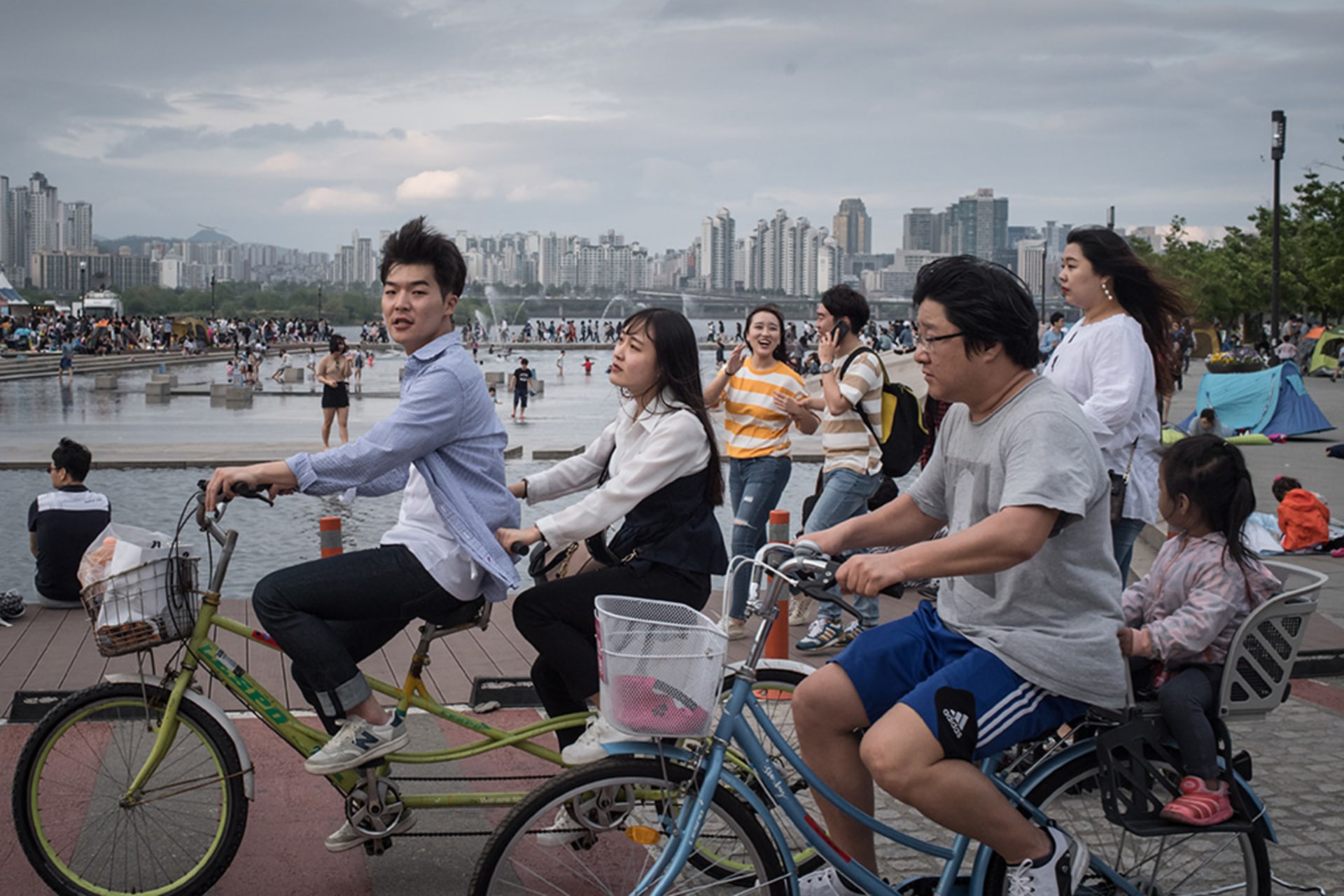<p>Youths ride bicycles in Yeouido Park in Seoul.</p>
