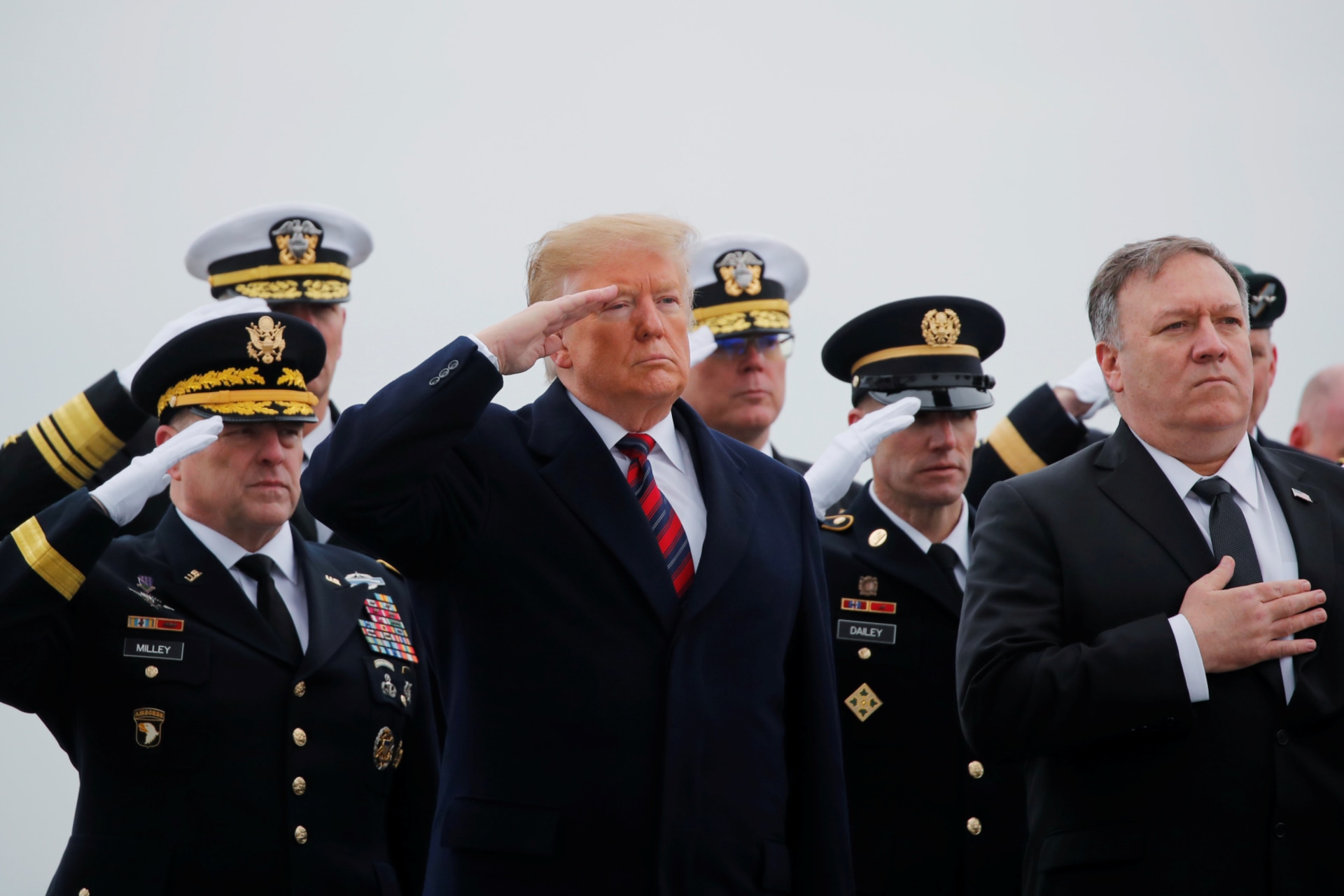 <p>Chief of Staff of the U.S. Army Mark Milley, President Donald Trump, Sgt. Maj. of the Army Daniel Dailey and Secretary of State Mike Pompeo salute as a military honor guard carries the casket of Scott Wirtz</p>
