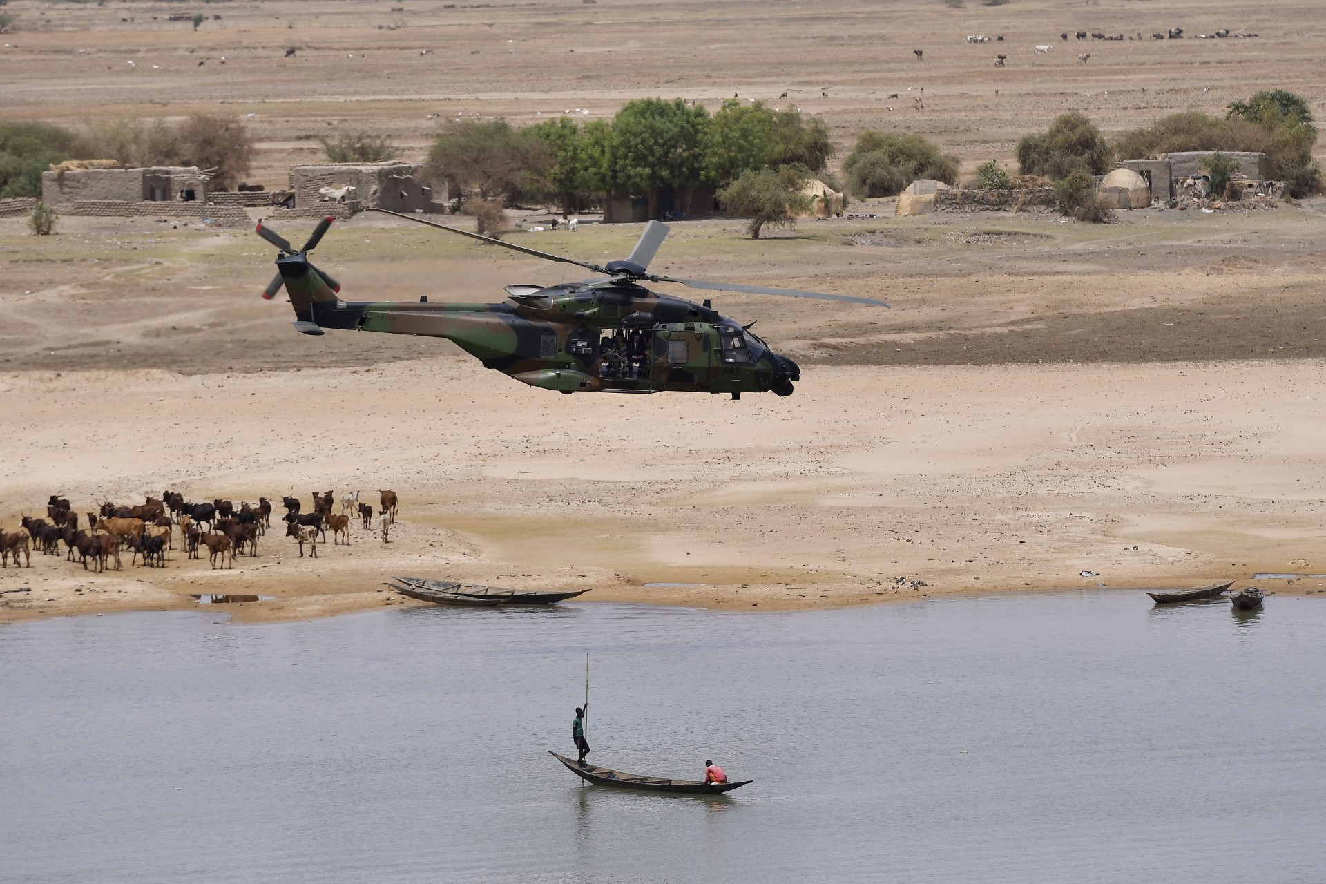 <p>French President Emmanuel Macron’s helicopter flies over Gao as he visits French troops in Africa’s Sahel region in Gao, northern Mali, on May 19, 2017.</p>