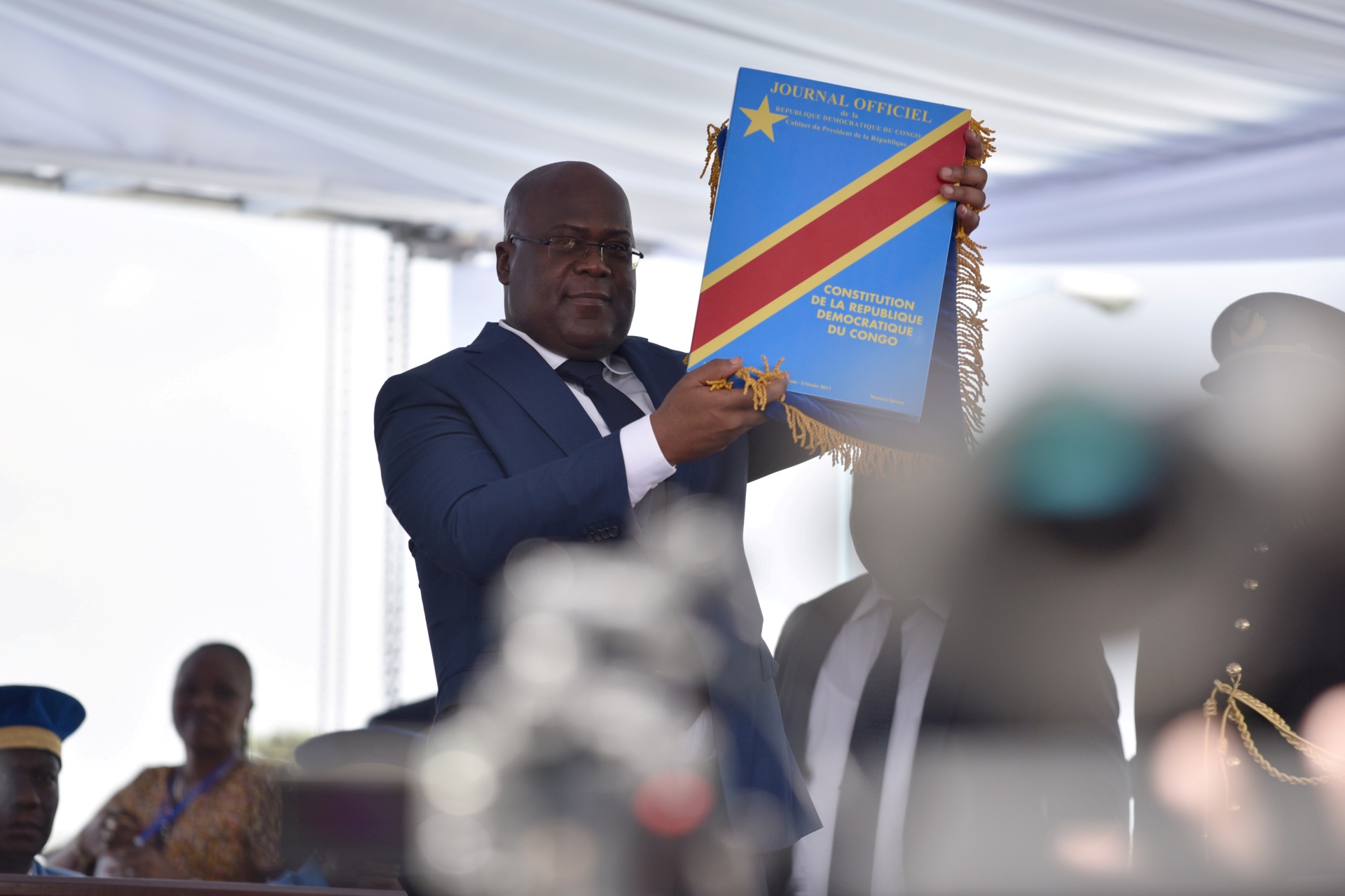 <p>Felix Tshisekedi holds up the constitution during the inauguration ceremony whereby Tshisekedi was sworn into office as the new president of the Democratic Republic of Congo in Kinshasa, Democratic Republic of Congo, on January 24, 2019.</p>
