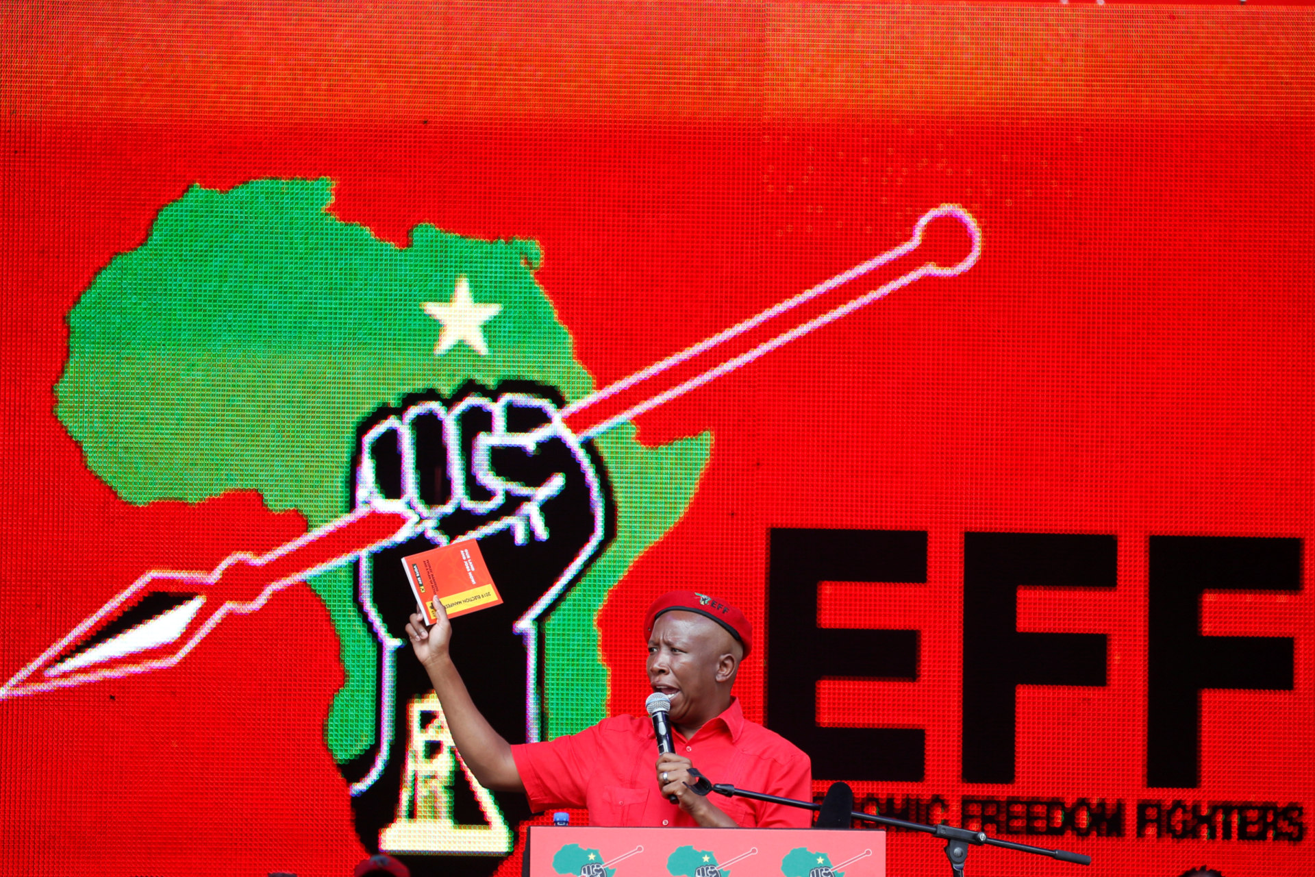 <p>President of South Africa’s radical left-wing party, the Economic Freedom Fighters (EFF), Julius Malema, holds a copy of the party’s election manifesto in Soshanguve, near Pretoria, South Africa, on February 2, 2019. </p>