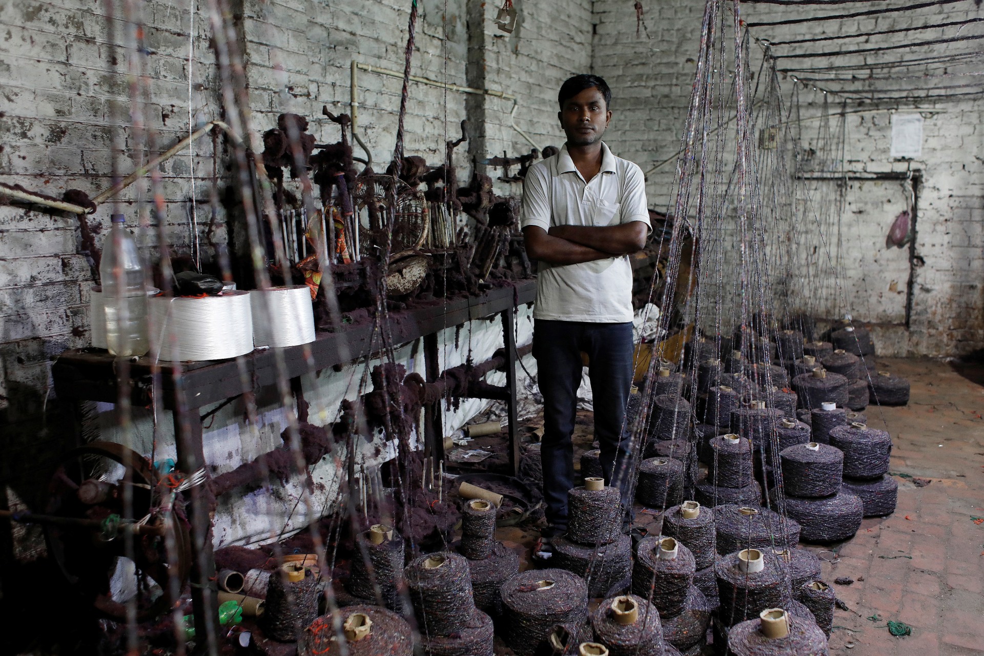 <p>Ram Pratap, who lost his job as a powerloom operator earlier this year, poses for a picture inside a weaving factory where he used to work, in Panipat in the northern state of Haryana, India, </p>
