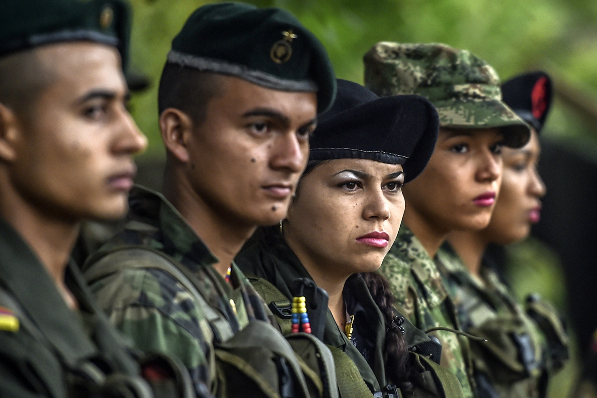 <p>Members of the Revolutionary Armed Forces of Colombia stand during a ceremony at a camp in the Colombian mountains.</p>
