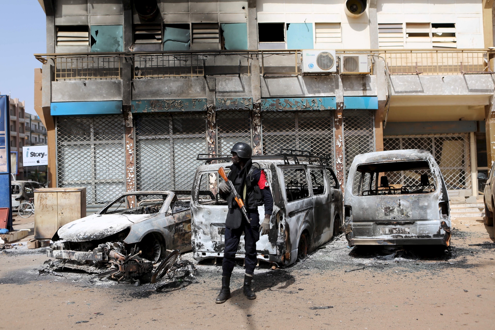 <p>A soldier across the street from Splendid Hotel in Ouagadougou, Burkina Faso, on January 17, 2016, after security forces retook the hotel from al-Qaeda fighters who seized it in an assault that killed two dozen people from eighteen different countries.</p>
