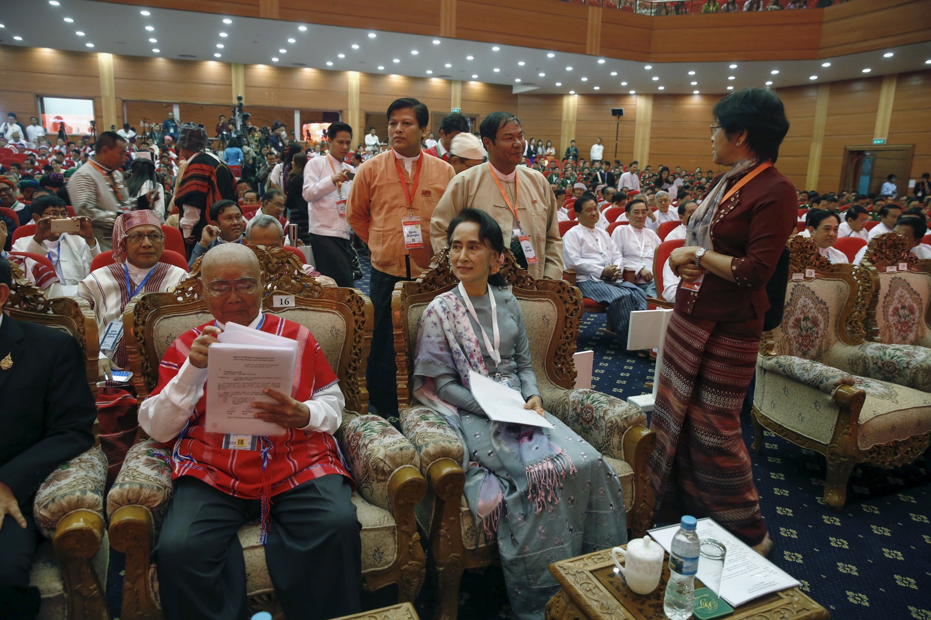 <p>Myanmar’s Aung San Suu Kyi smiles as she arrives to give a speech during talks between the government, army and representatives of ethnic armed groups over a ceasefire to end insurgencies, in Naypyitaw on January 12, 2016. </p>
