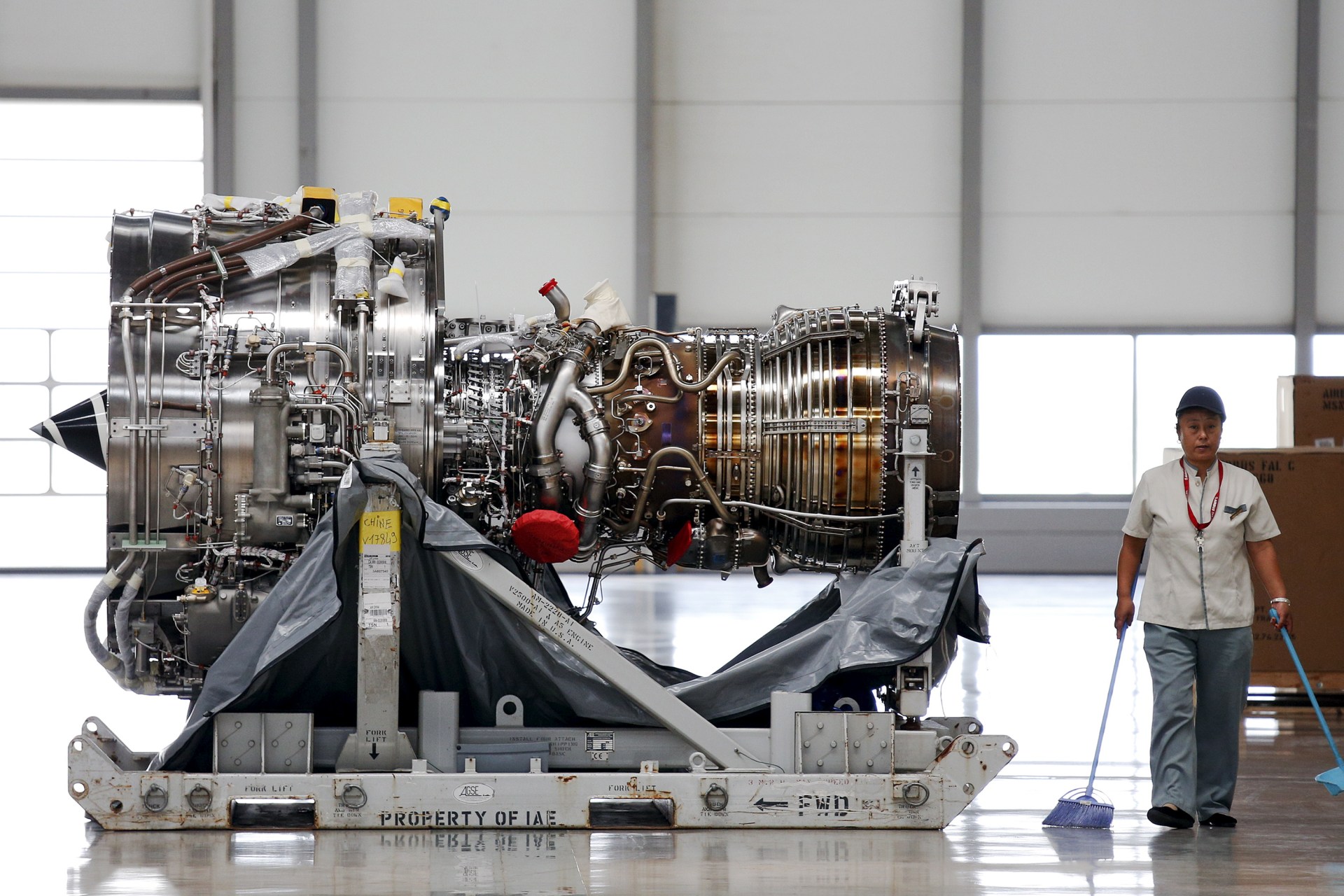 <p>An employee walks past an engine at the Airbus factory in Tianjin, China, August 12, 2015.</p>
