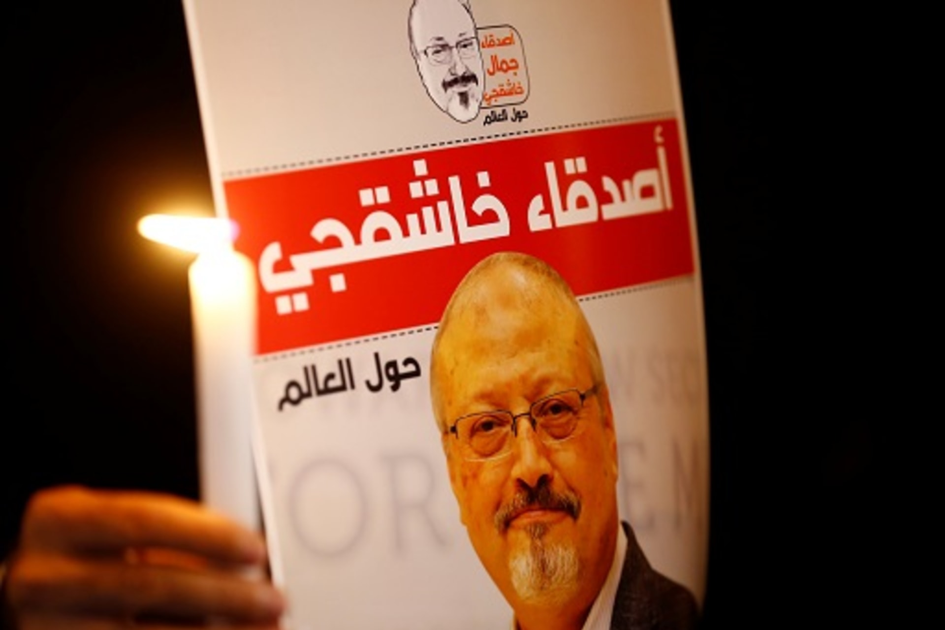<p>A demonstrator holds a poster with a picture of Saudi journalist Jamal Khashoggi. </p>
