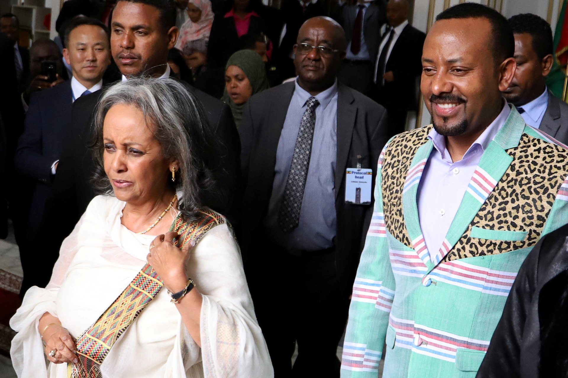 <p>Ethiopia’s Prime Minister Abiy Ahmed walks with the newly elected President Sahle-Work Zewde, as they leave House of Peoples’ Representatives in Addis Ababa, Ethiopia on October 25, 2018</p>