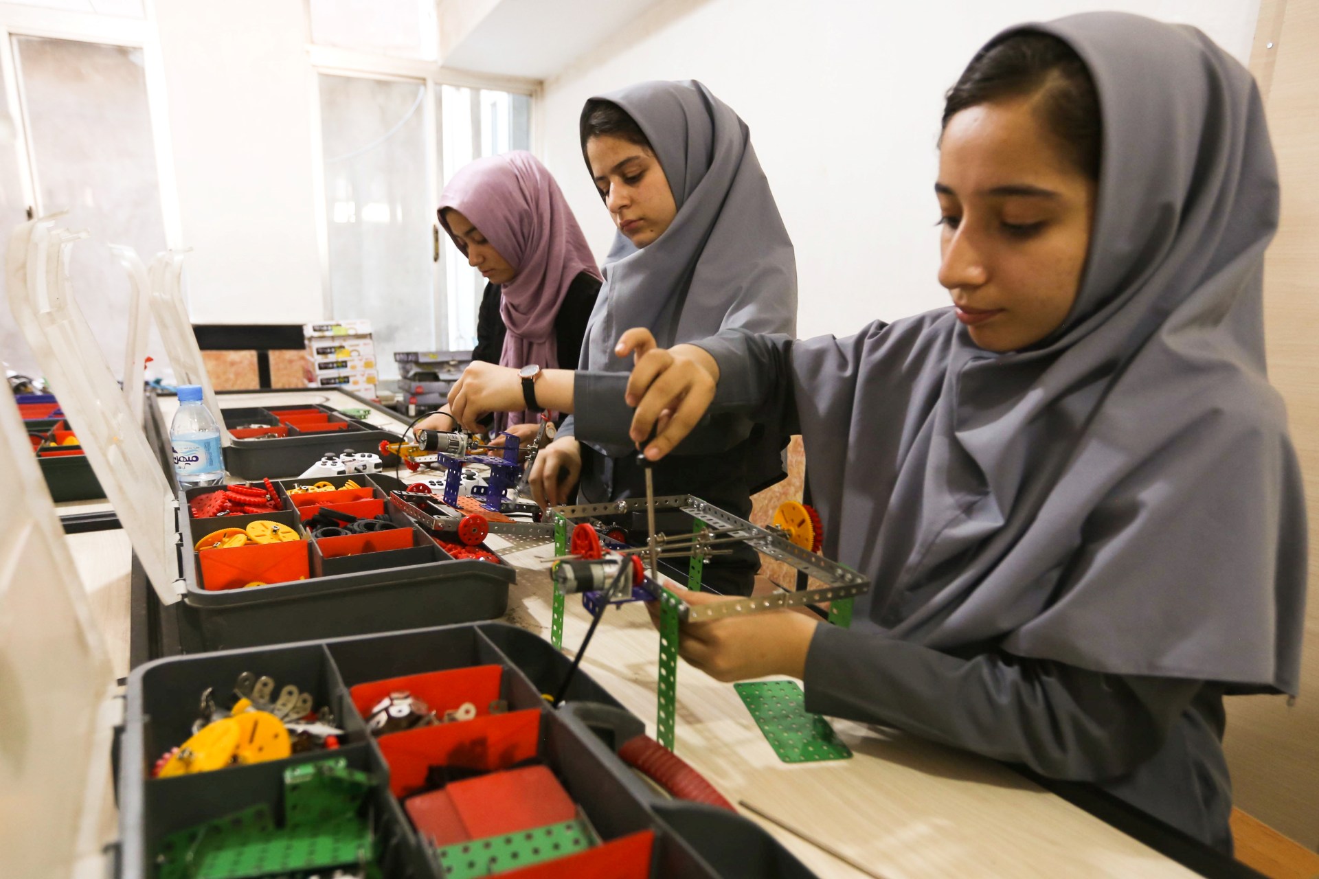 <p>Members of Afghan robotics girls team work on their robots in Herat province.</p>
