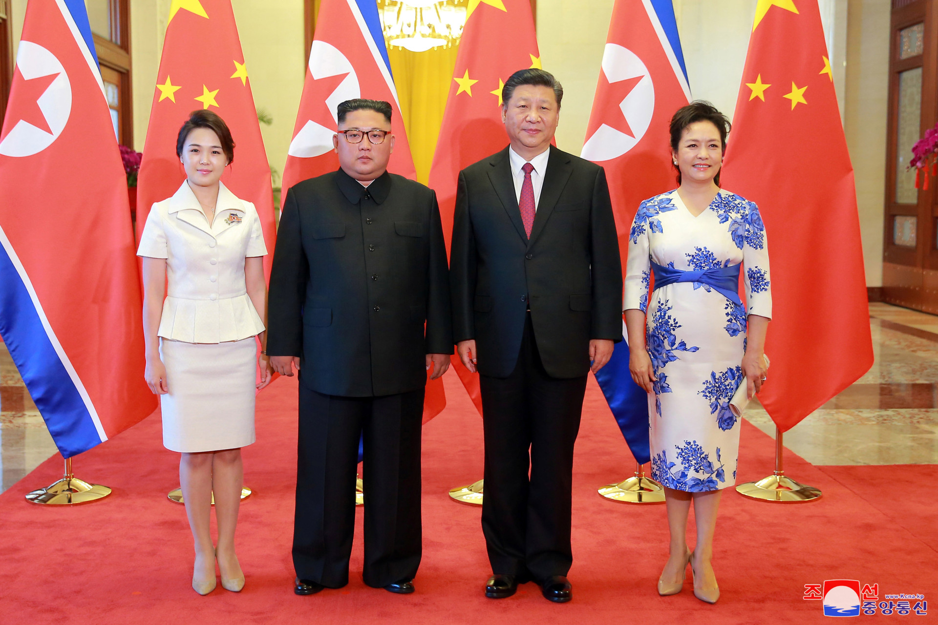 <p>North Korean leader Kim Jong-un and his wife Ri Sol-ju pose beside Chinese President Xi Jinping and his wife Peng Liyuan in Beijing, China, in this undated photo released June 20, 2018 by North Korea’s Korean Central News Agency.</p>
