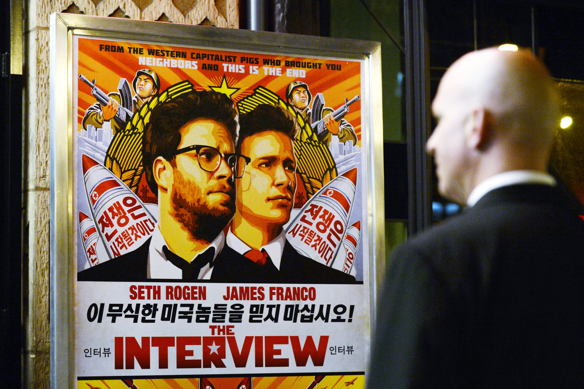 <p>A security guard stands at the entrance of United Artists theater during the premiere of the film “The Interview” in Los Angeles on December 11, 2014.</p>
