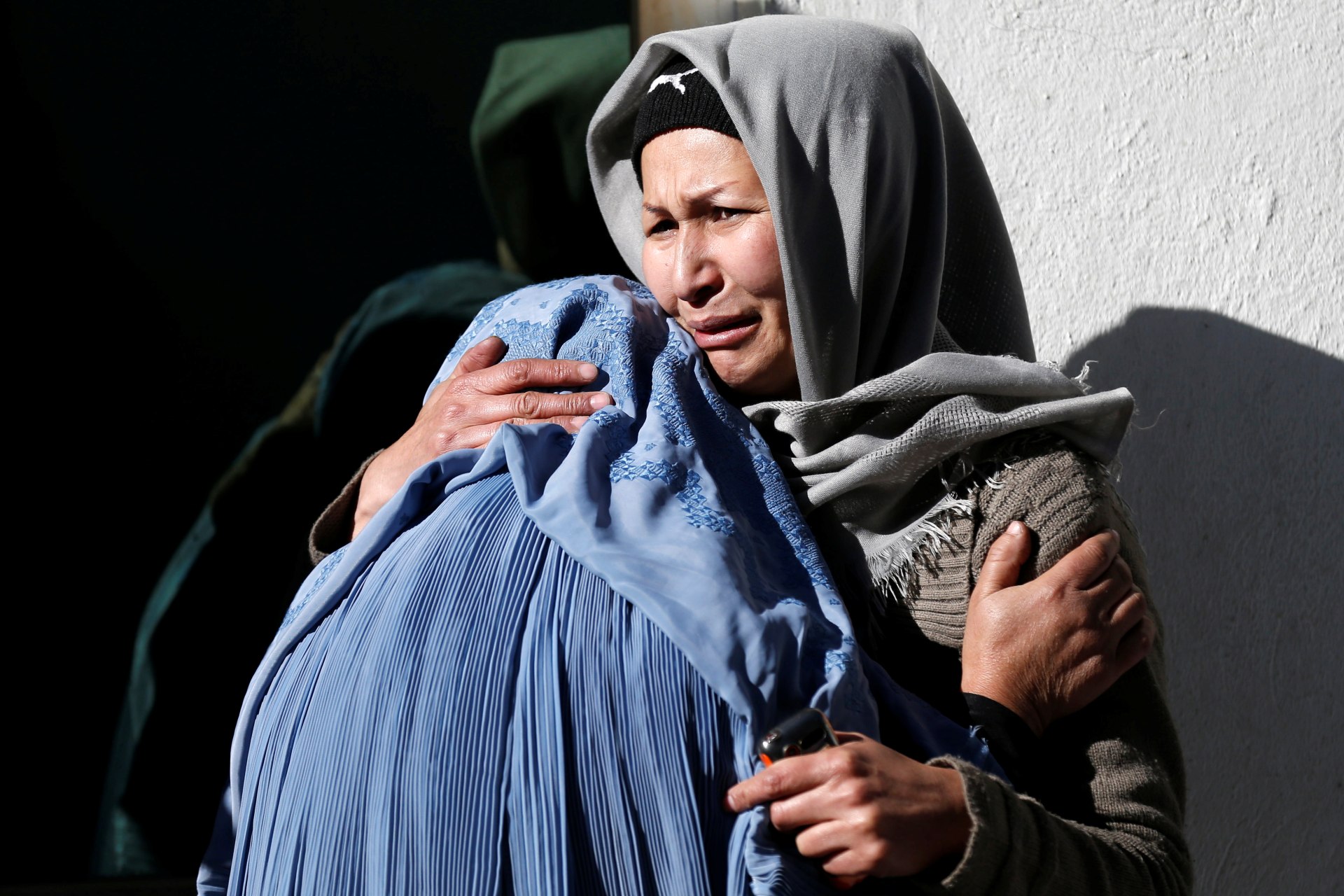 <p>Afghan women mourn inside a hospital compound after a suicide attack in Kabul, Afghanistan.</p>
