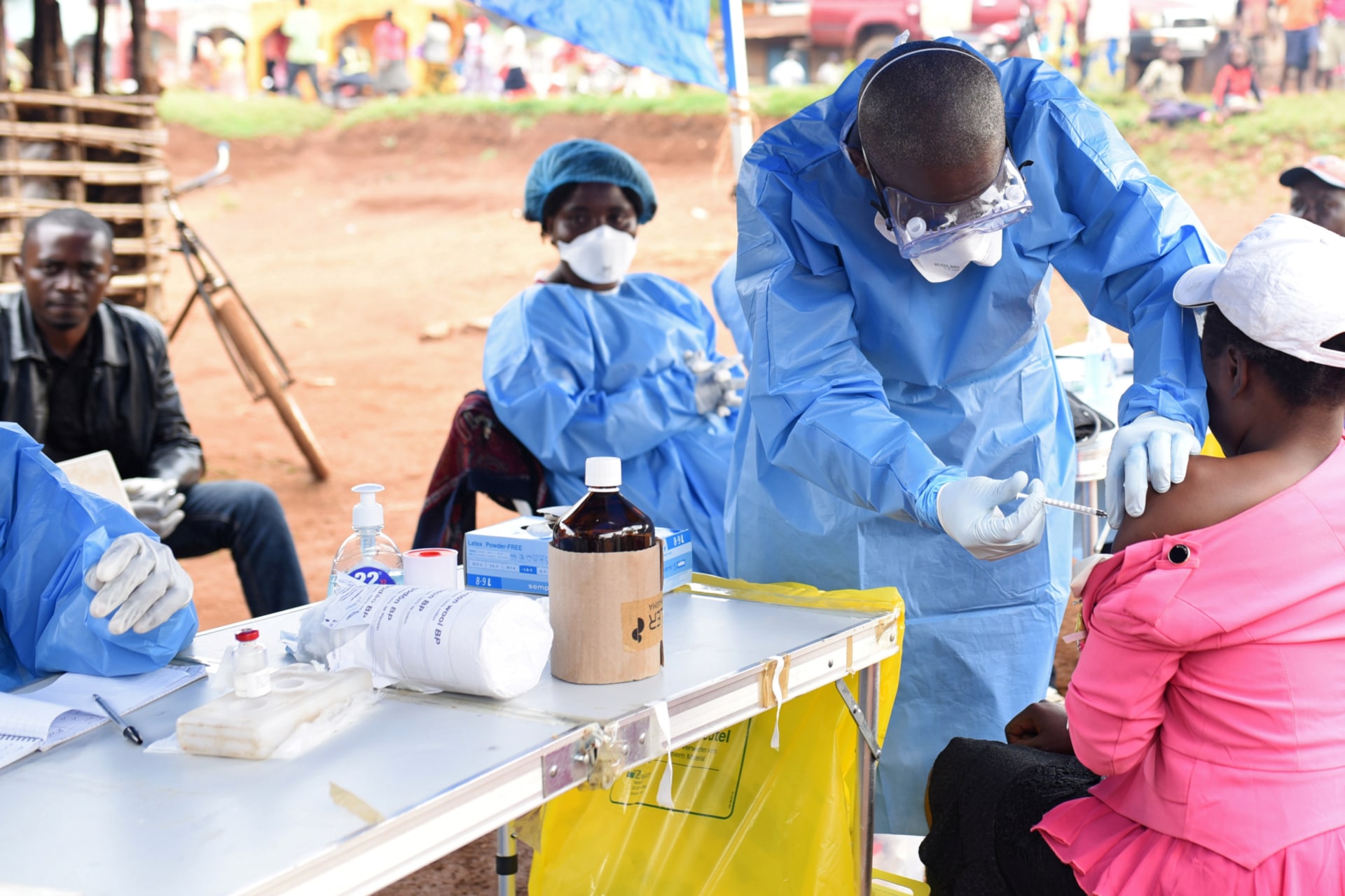 <p>A Congolese health worker administers Ebola vaccine to a woman who had contact with an Ebola sufferer in the village of Mangina in North Kivu province of the Democratic Republic of Congo, August 18, 2018. </p>

