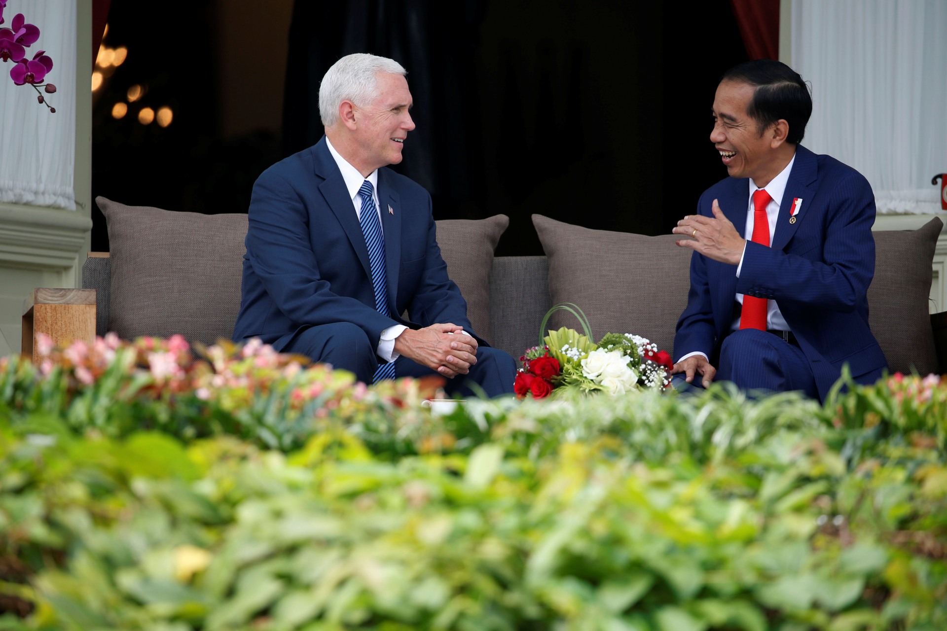 <p>U.S. Vice President Mike Pence talks to Indonesia’s President Joko Widodo, at the veranda of the Presidential Palace in Jakarta, Indonesia on April 20, 2017.</p>

