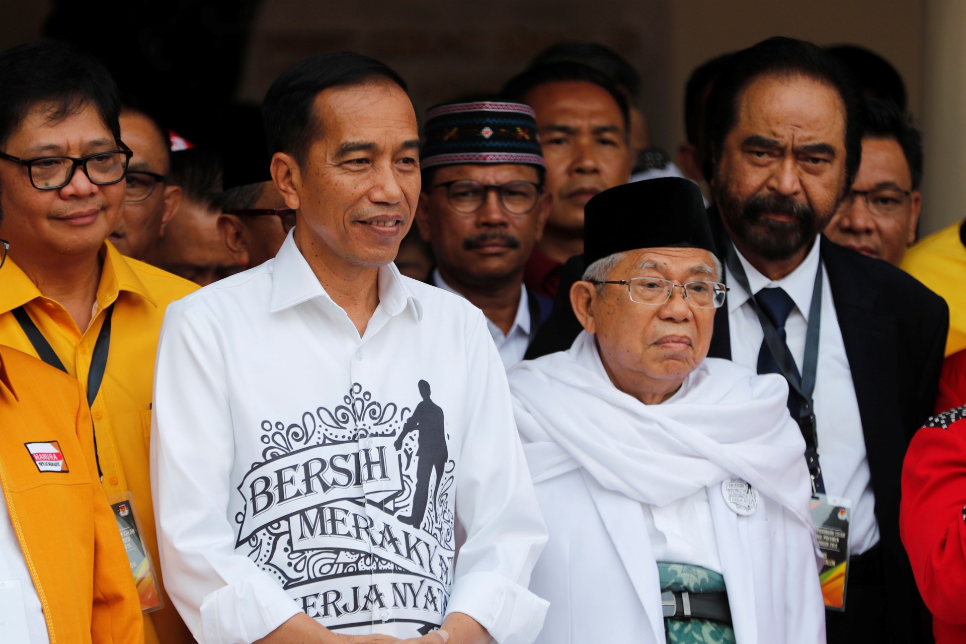 <p>Indonesian President Joko Widodo (L) and his running mate for the 2019 presidential elections Islamic cleric Ma’ruf Amin (R) meet supporters in Jakarta, Indonesia on August 10, 2018. </p>