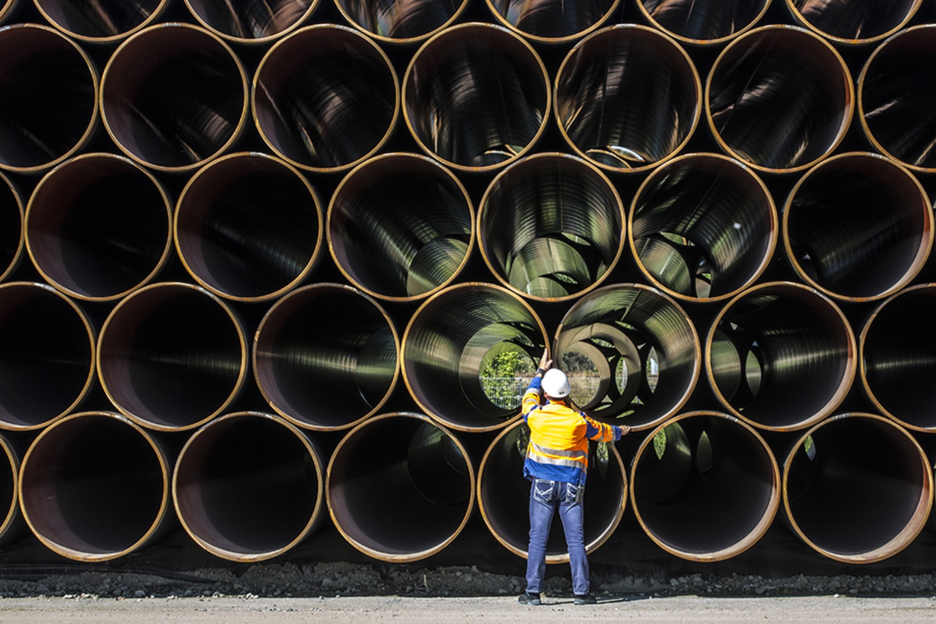 <p>A worker inspects pipes for the Nord Stream 2 at a site on Germany’s Baltic Sea coast.</p>
