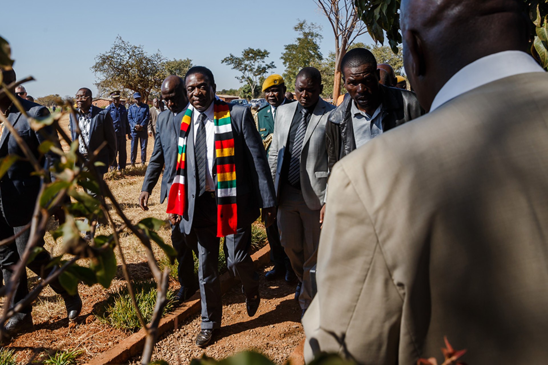 <p>Zimbabwe President Emmerson Mnangagwa leaves the polling station after casting his ballot at Sherwood Primary School in Kwekwe on July 30 2018, during general elections.</p>