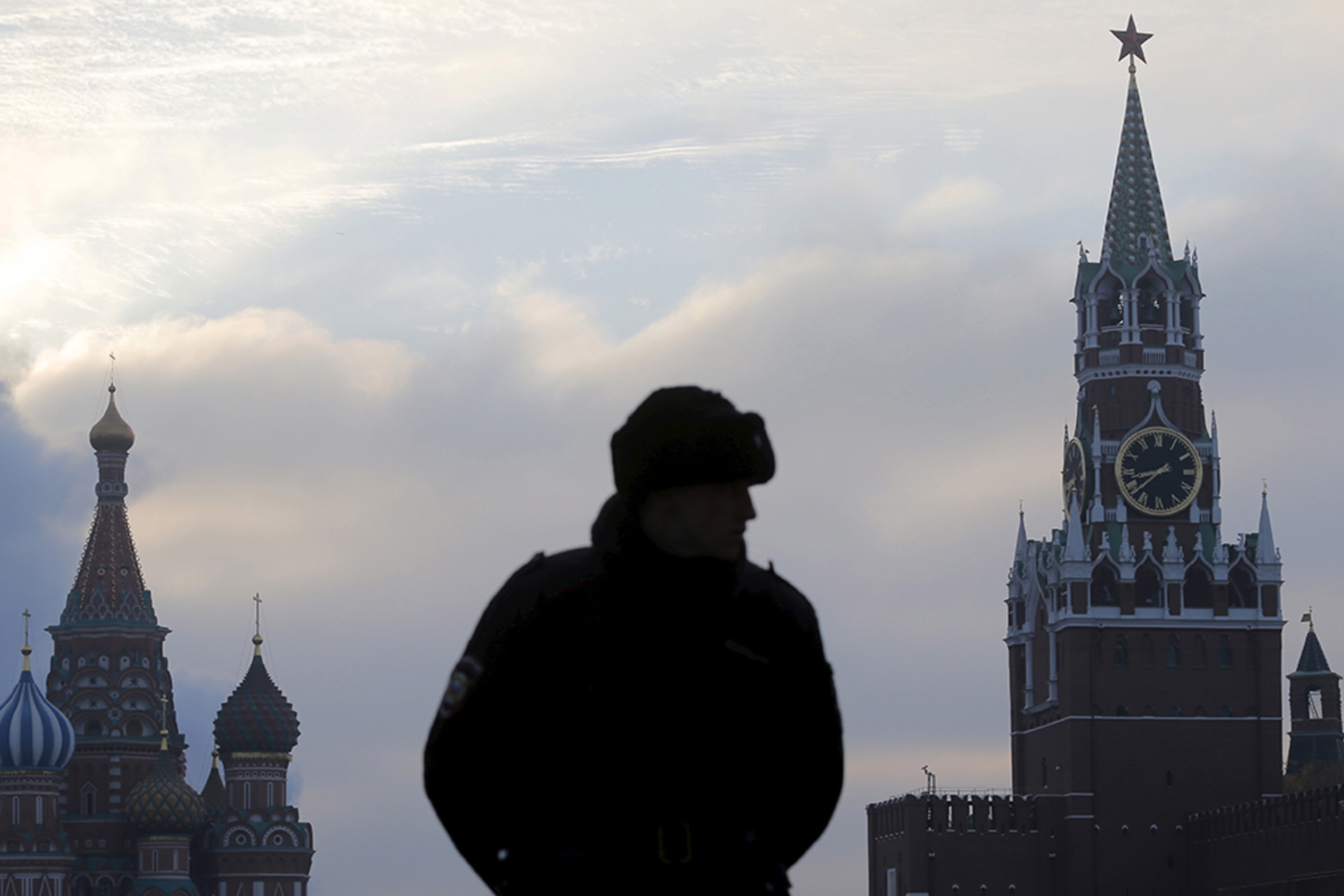 <p>A guard stands in front of St. Basil’s Cathedral and the Kremlin in Moscow, the centers of political and religious authority in Russia for much of the past several centuries.</p>
