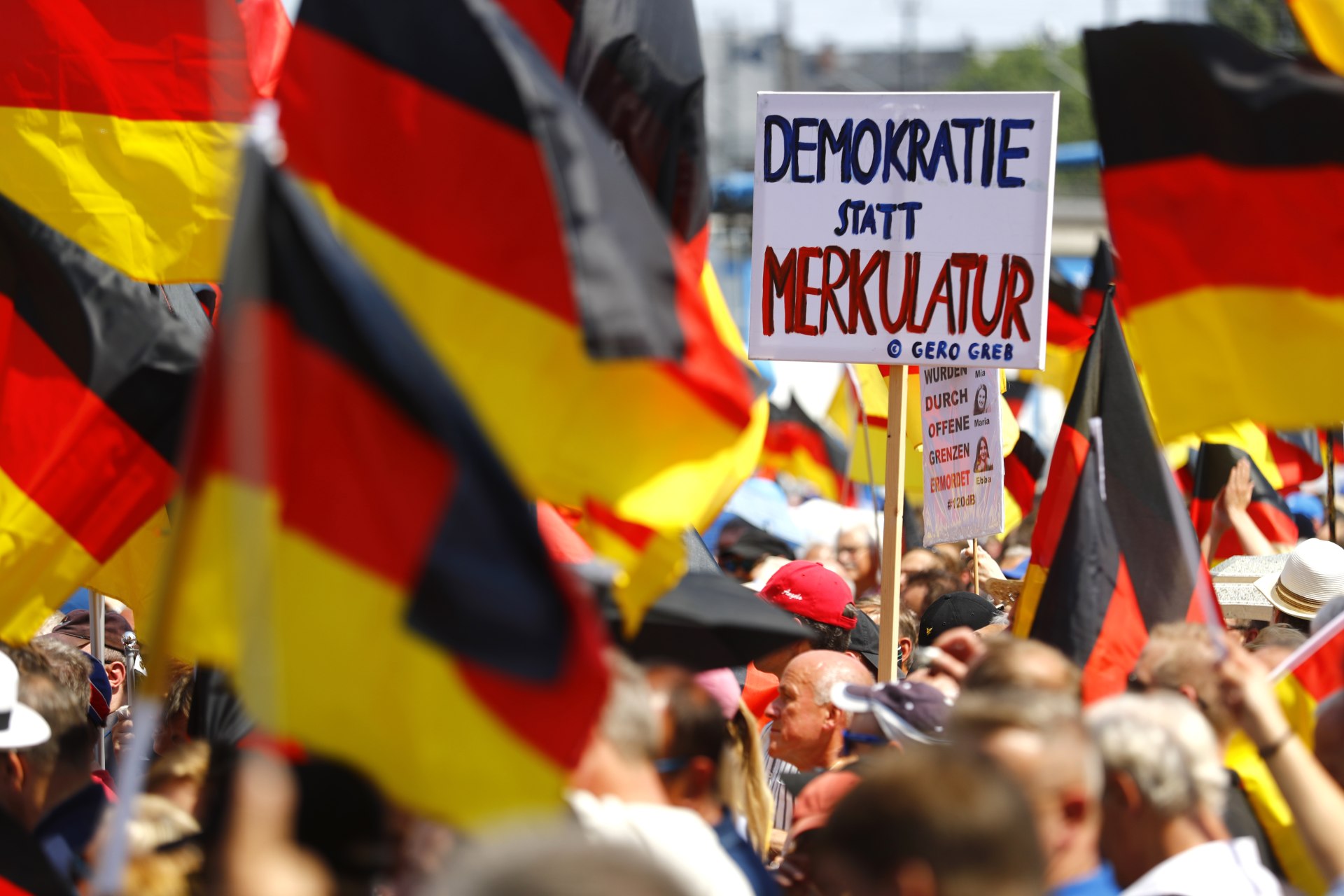 <p>Supporters of the anti-immigration party Alternative for Germany (AfD) hold a protest in Berlin, Germany on May 27, 2018. </p>

