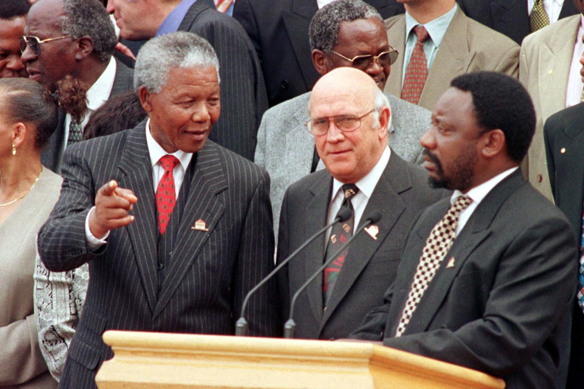 <p>President Nelson Mandela chats with Deputy President F.W. de Klerk and Constitutional Assembly chair Cyril Ramaphosa outside Parliament after the approval of South Africa’s new constitution, May 8, 1996.</p>
