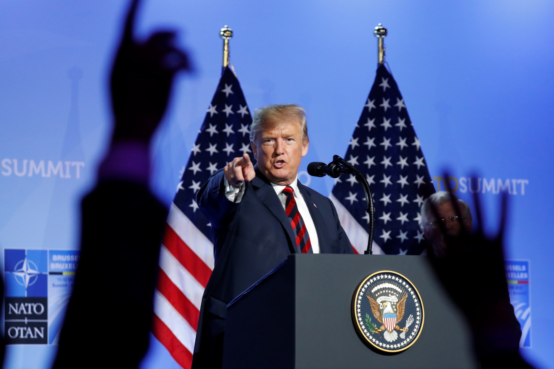 <p>U.S. President Donald Trump takes questions from the media during a news conference after participating in the NATO Summit in Brussels, Belgium on July 12, 2018.</p>