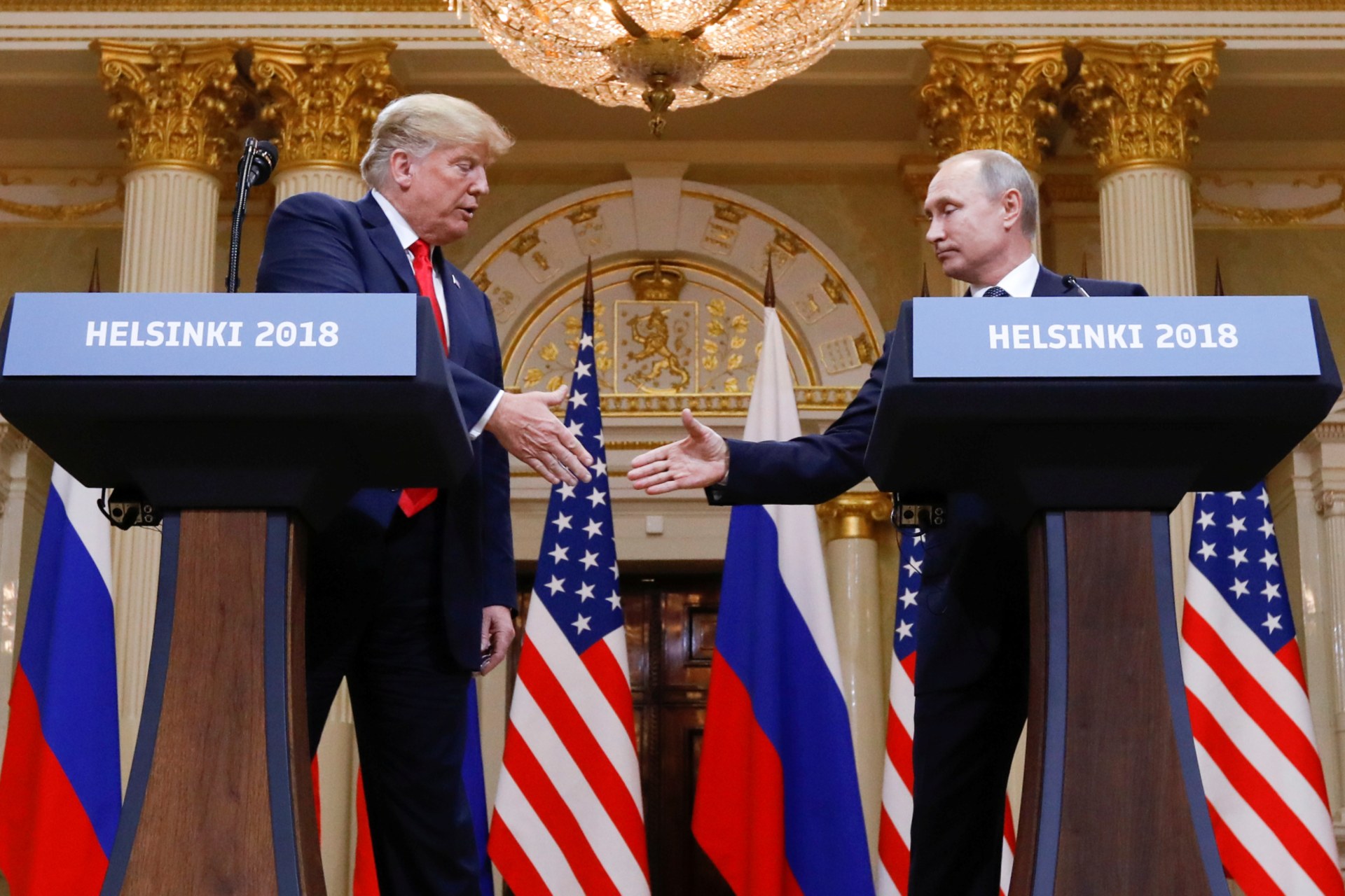 <p>U.S. President Donald Trump and Russia’s President Vladimir Putin shake hands during a joint news conference after their meeting in Helsinki, Finland, July 16, 2018. </p>