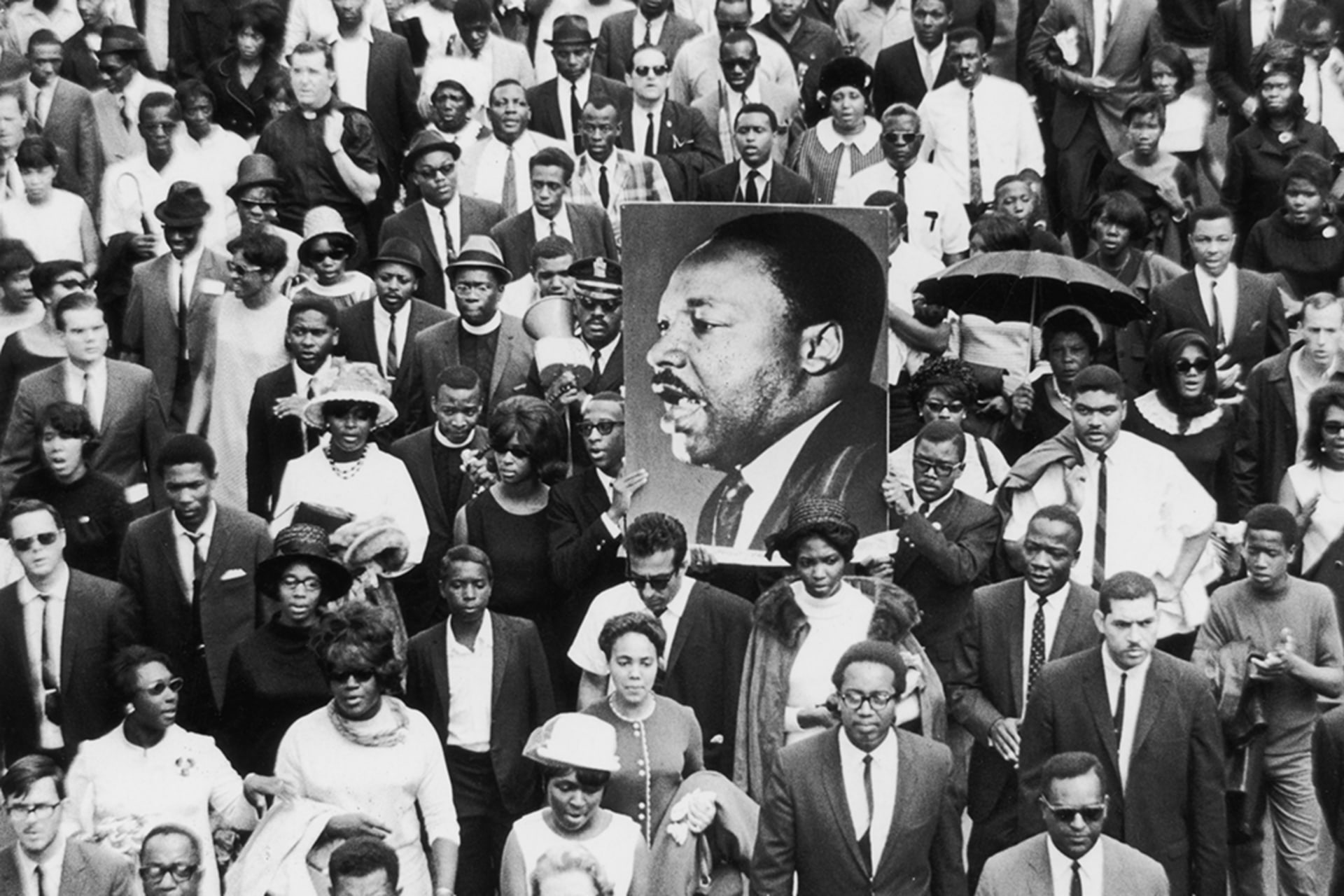 <p>Mourners take part in a procession following the death of civil rights leader Martin Luther King, Jr., whose assassination was among the pivotal events of 1968.</p>